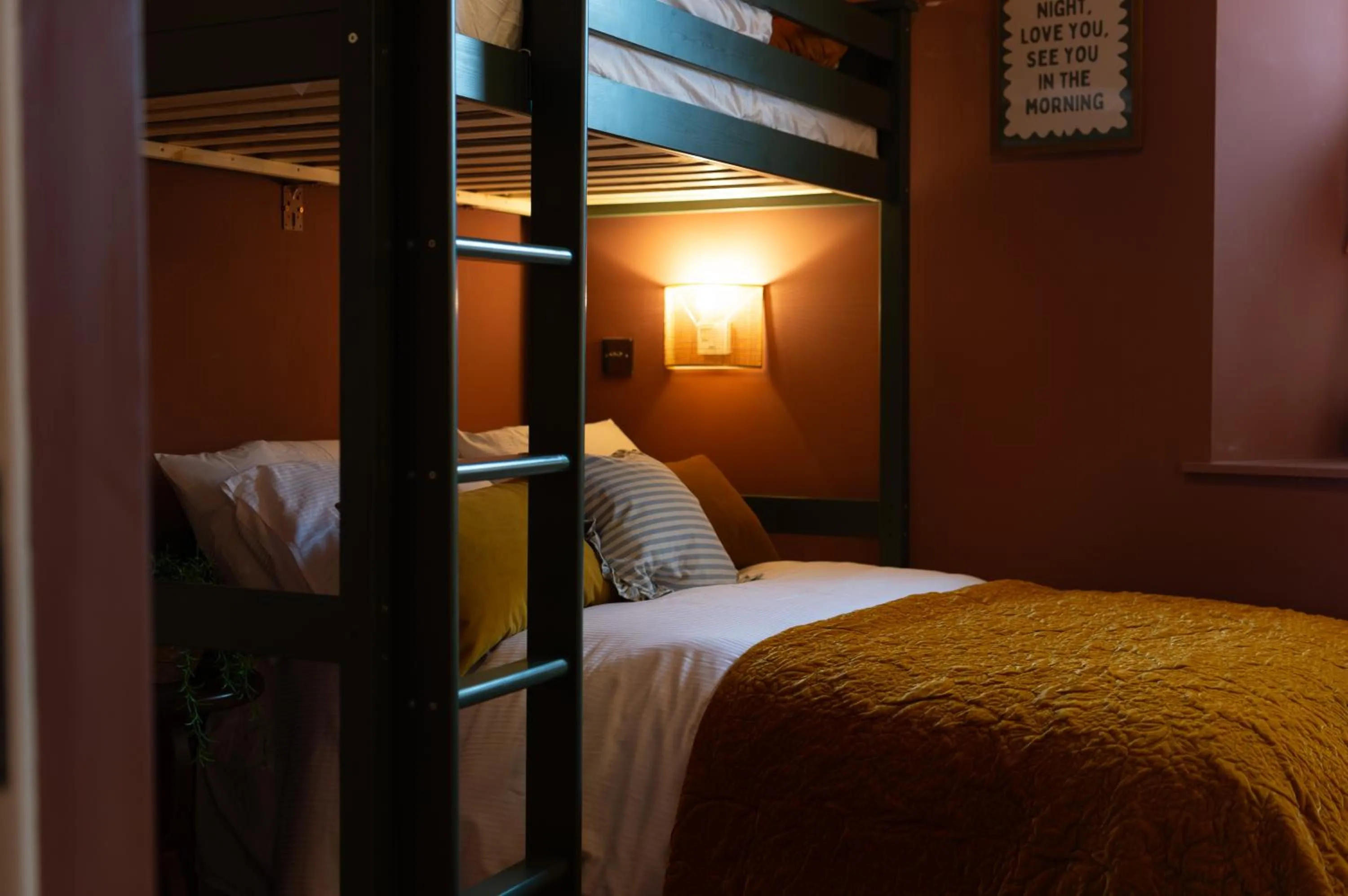 Communal lounge/ TV room, Bed in The Beach House Boutique Hotel