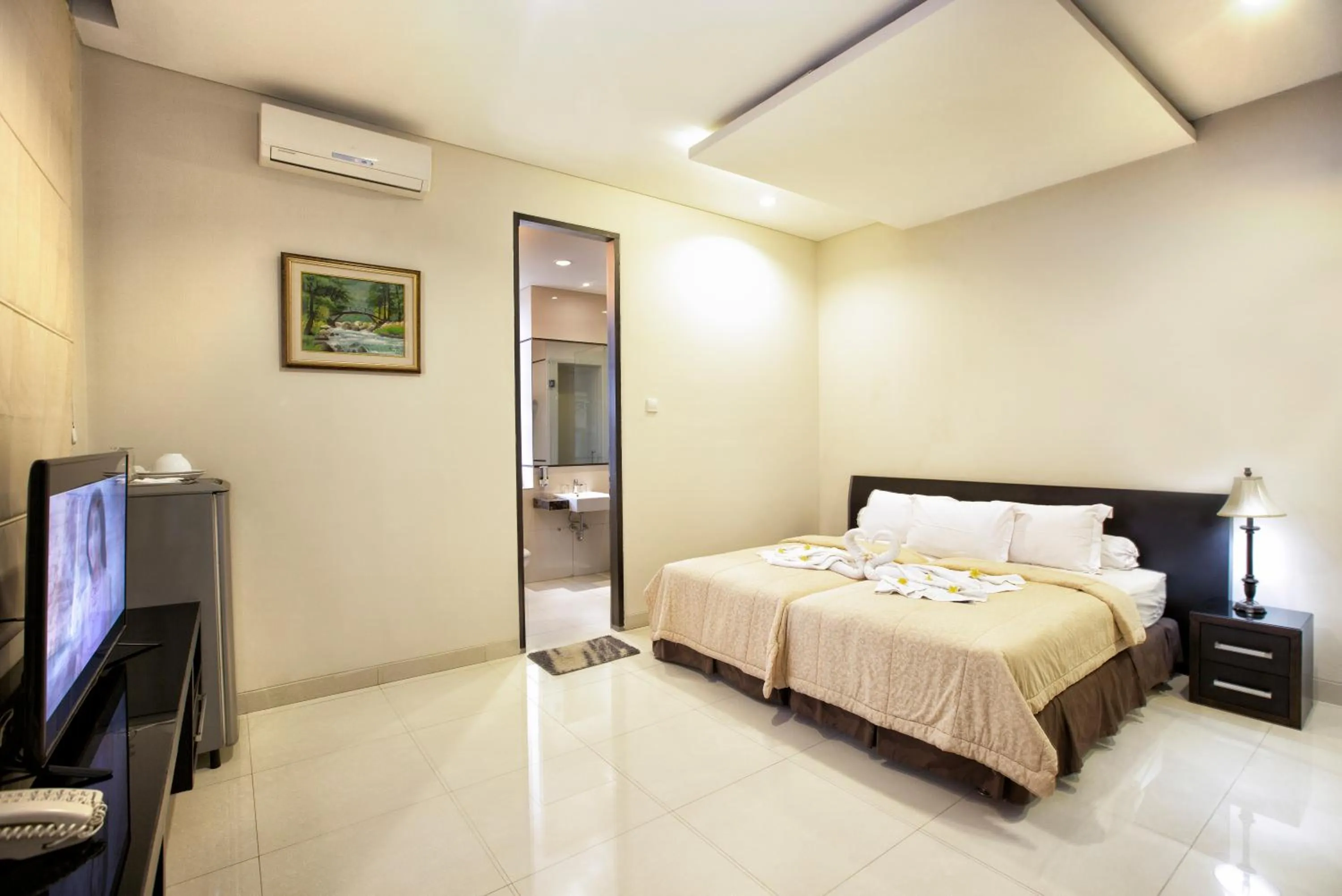 Bed in InKuta Residence and Villa