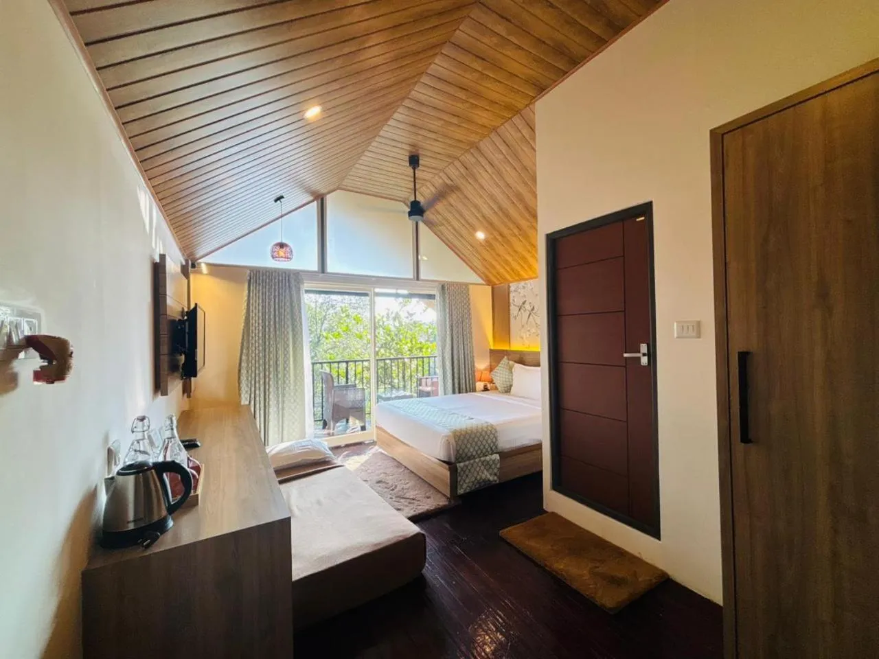 Photo of the whole room, Bed in Bamboo Dale Resort & Spa Munnar by Stride