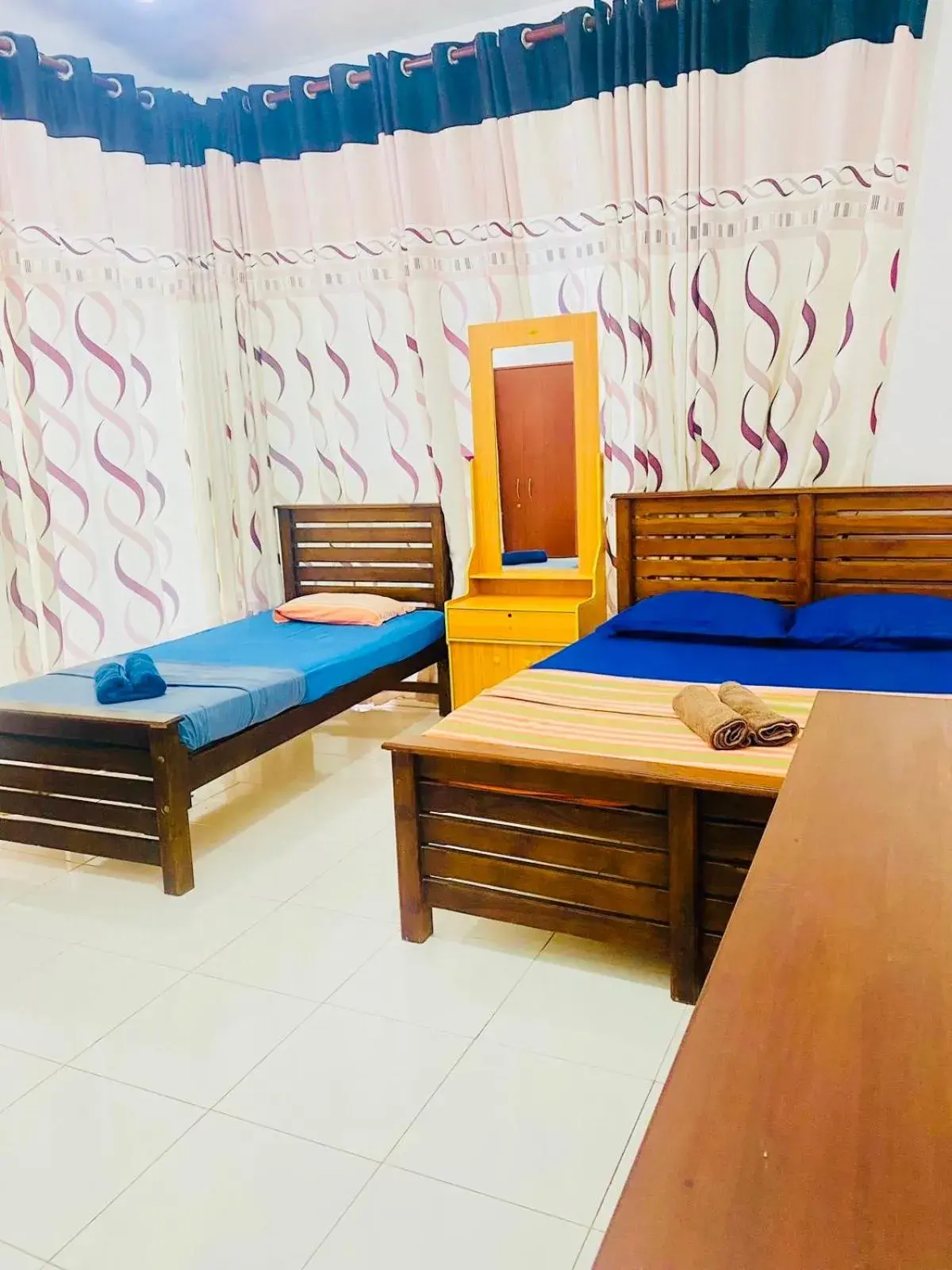 Deluxe Triple Room in The Beach House , Nilaveli , Trincomalee Deluxe Triple Room in The Beach House , Nilaveli , Trincomalee