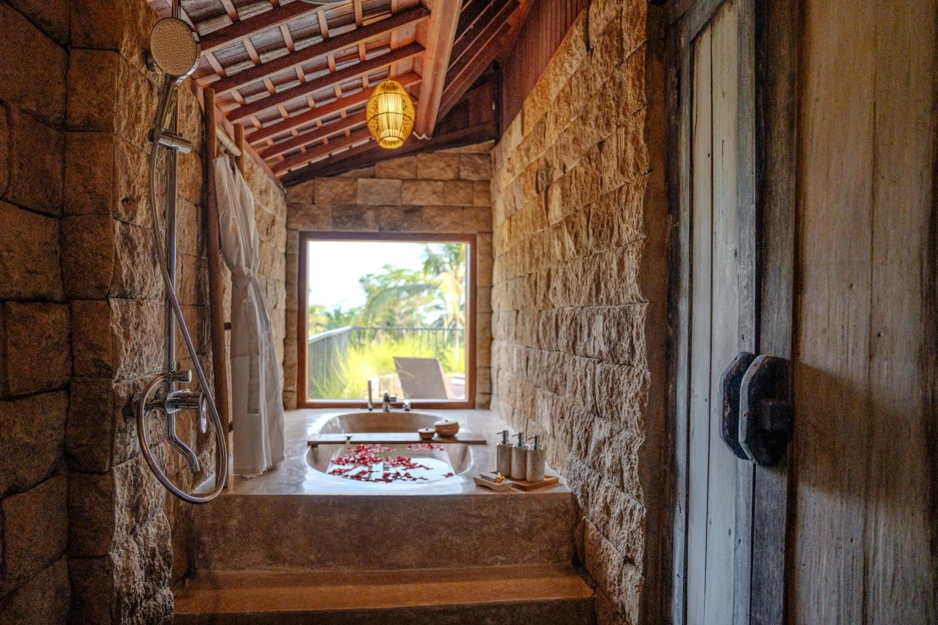 Bathroom in Hoshi Jungle Resort by Dhananjaya Hospitality