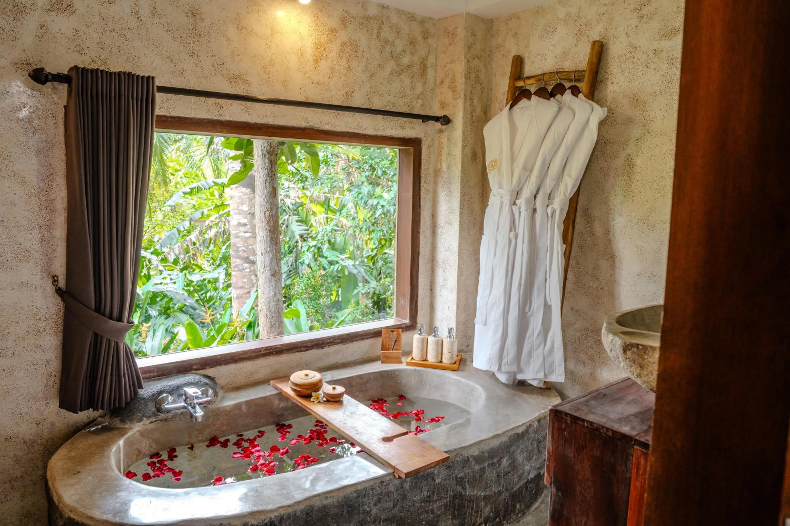 Bathroom in Hoshi Jungle Resort by Dhananjaya Hospitality