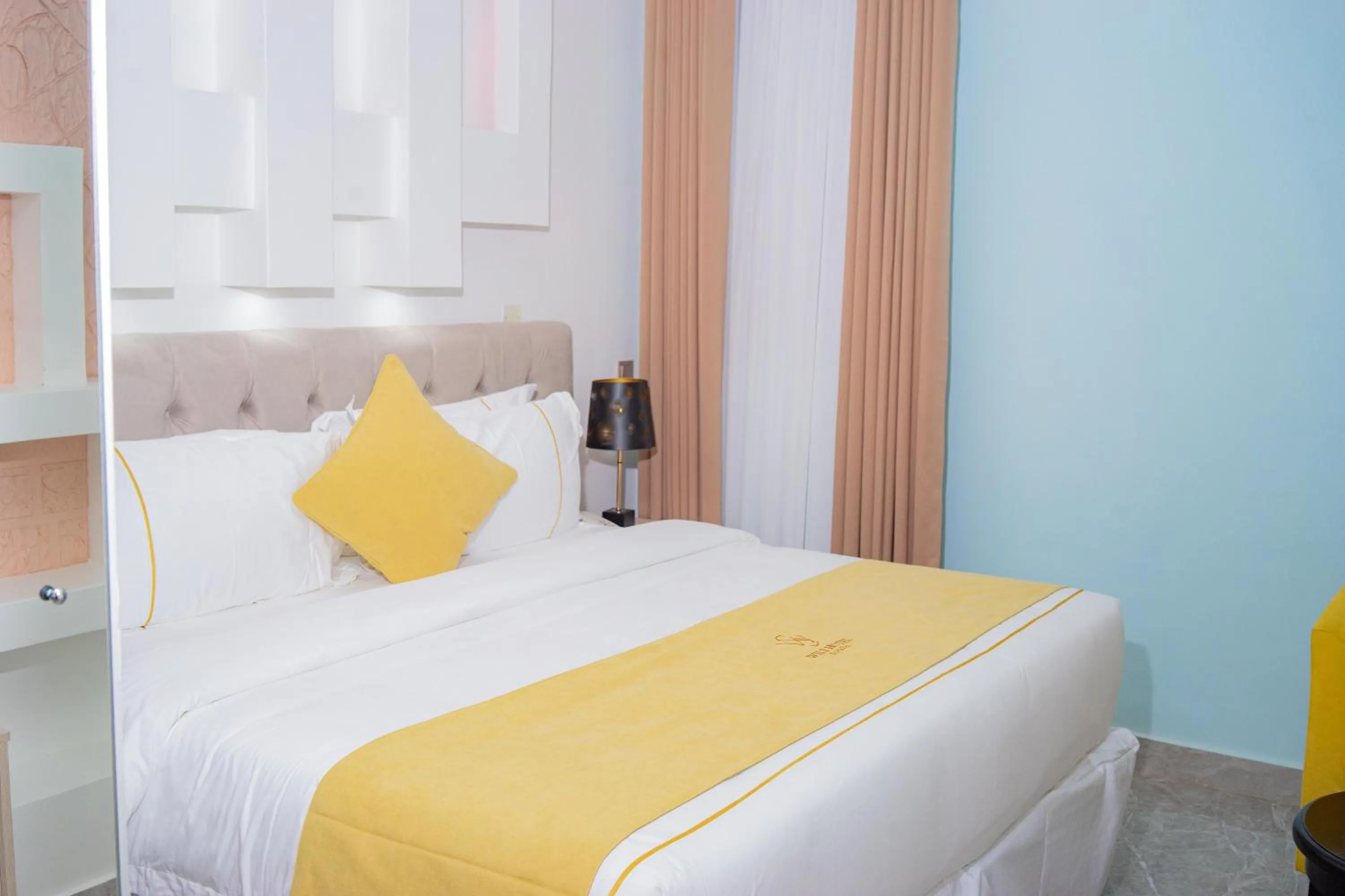 Bed in Wils Hotel Supreme