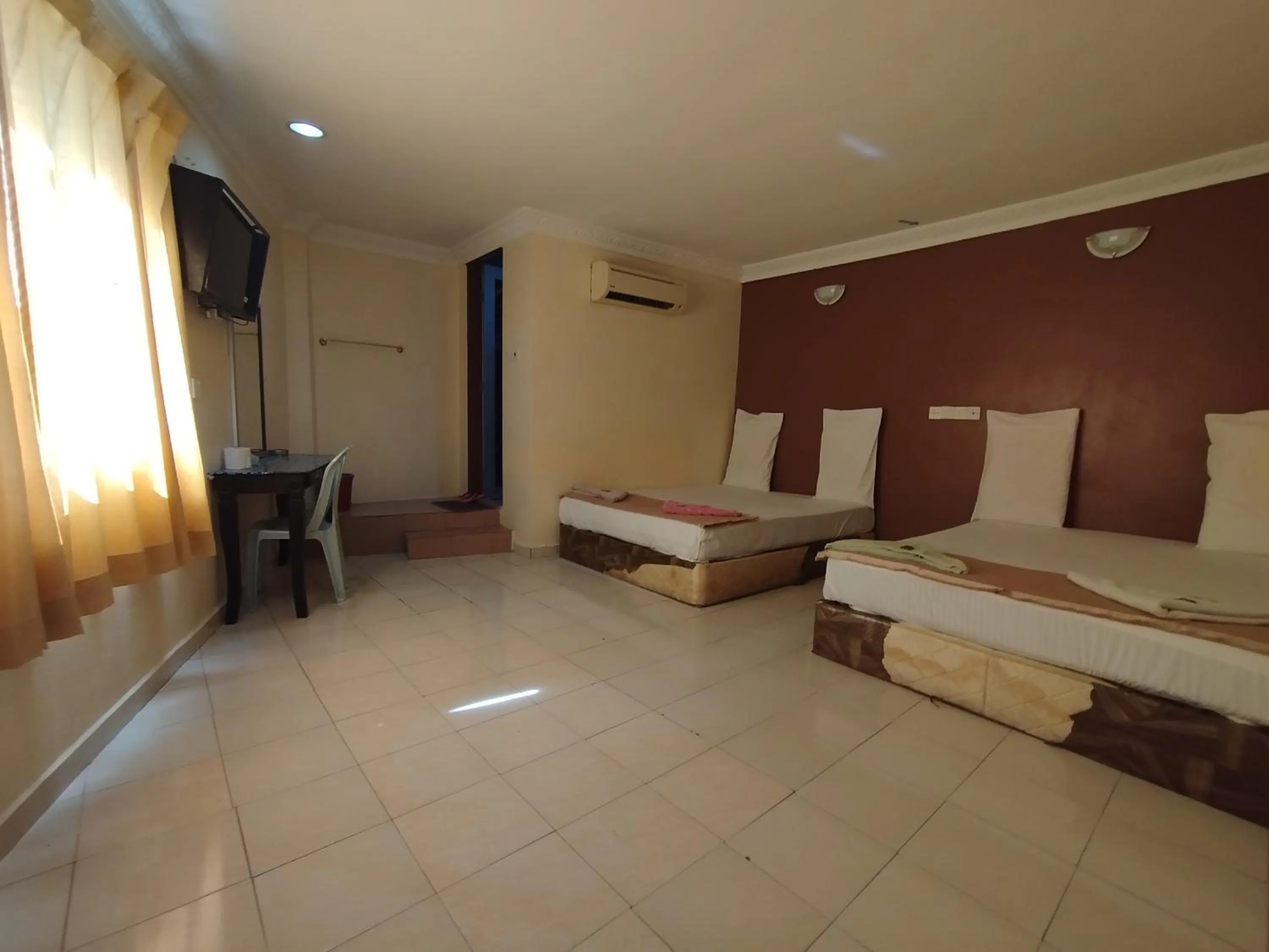 Bed in Sentosa Villa Hotel