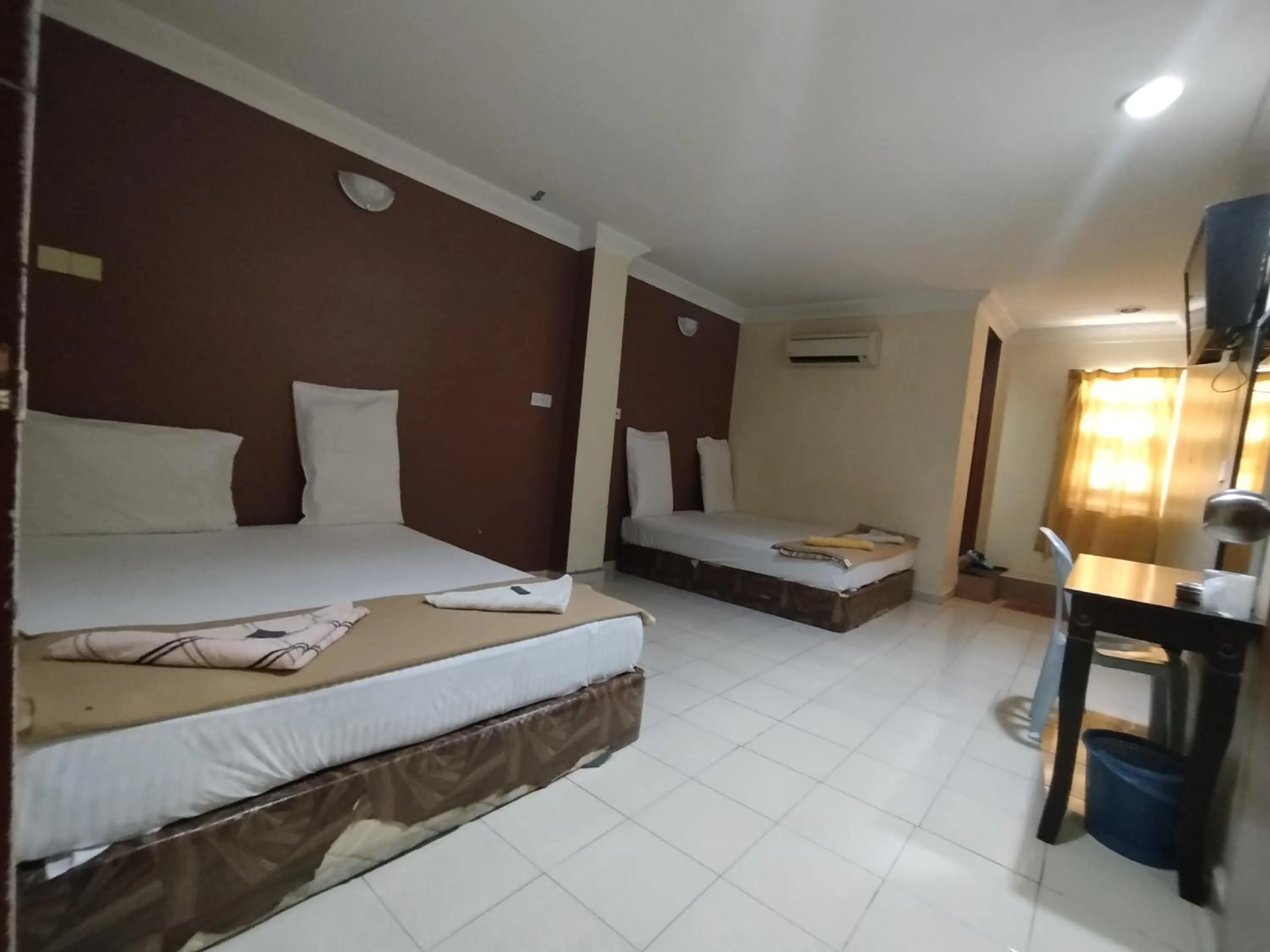 Bed in Sentosa Villa Hotel