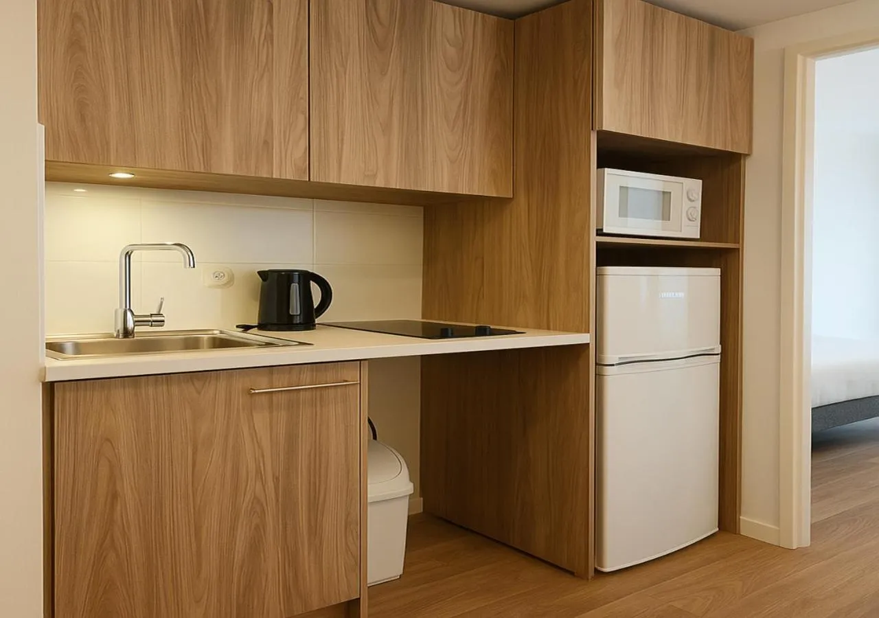 Kitchen or kitchenette in Zenao Appart'hôtels Le Raincy Thiers