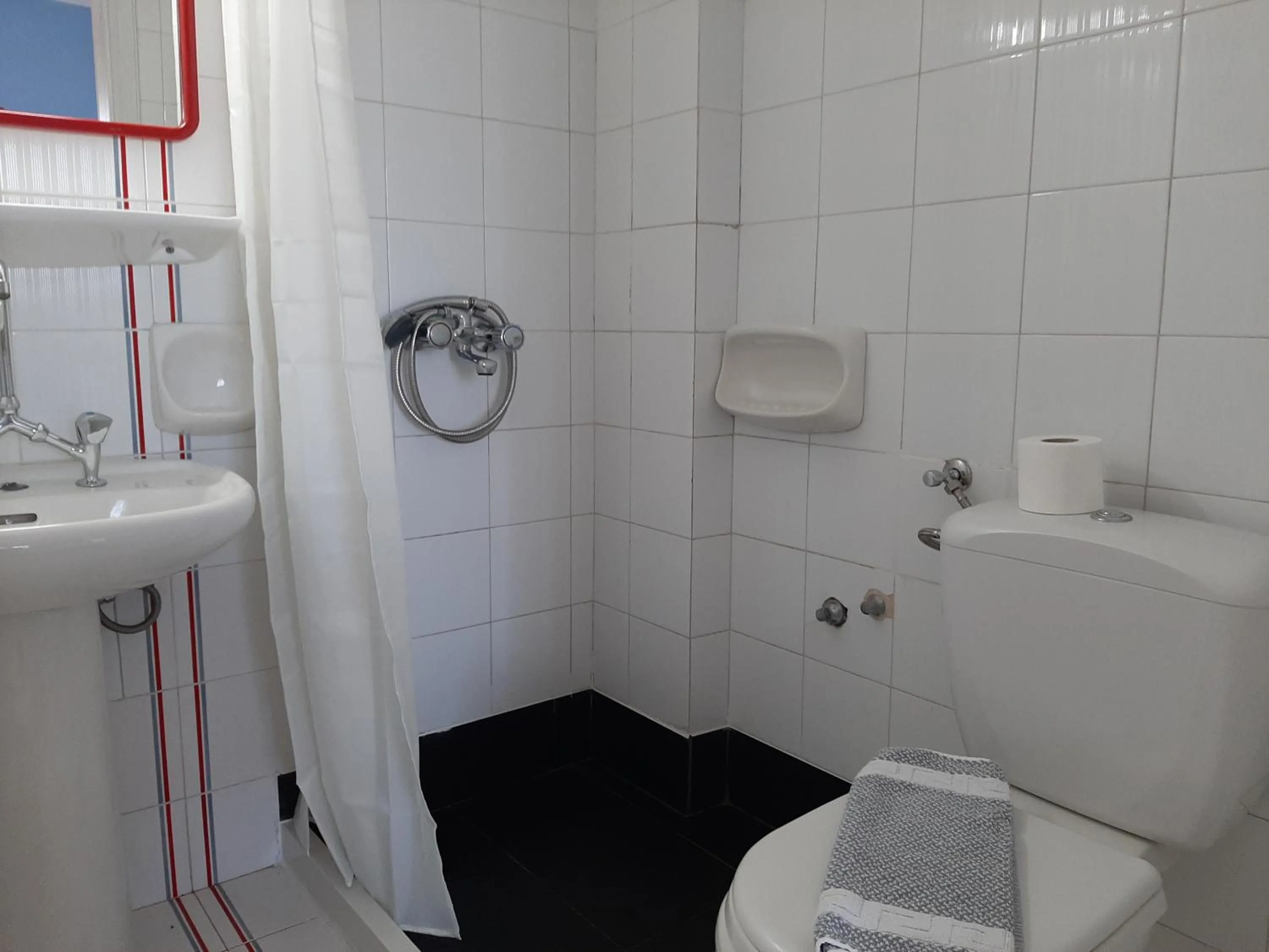 Bathroom in Remi Apartments