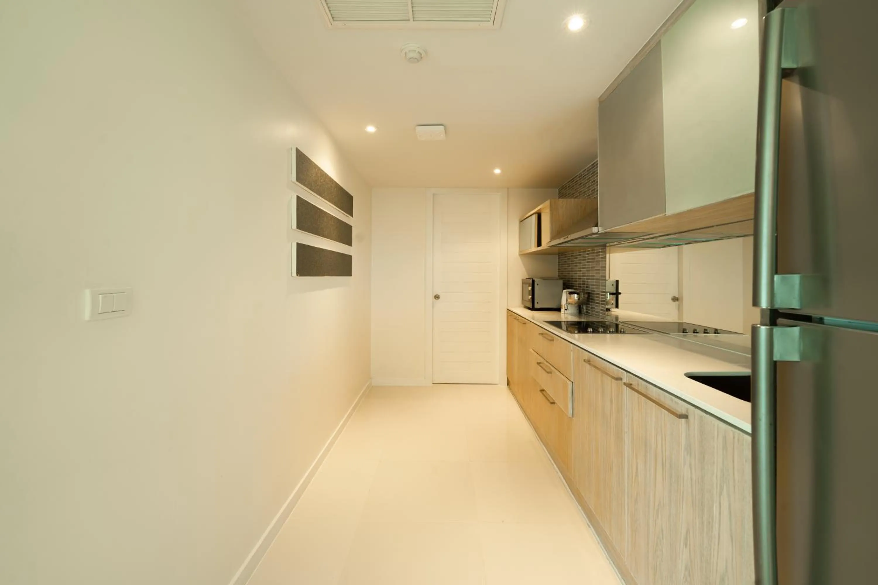 Kitchen or kitchenette in Yenna Apartment