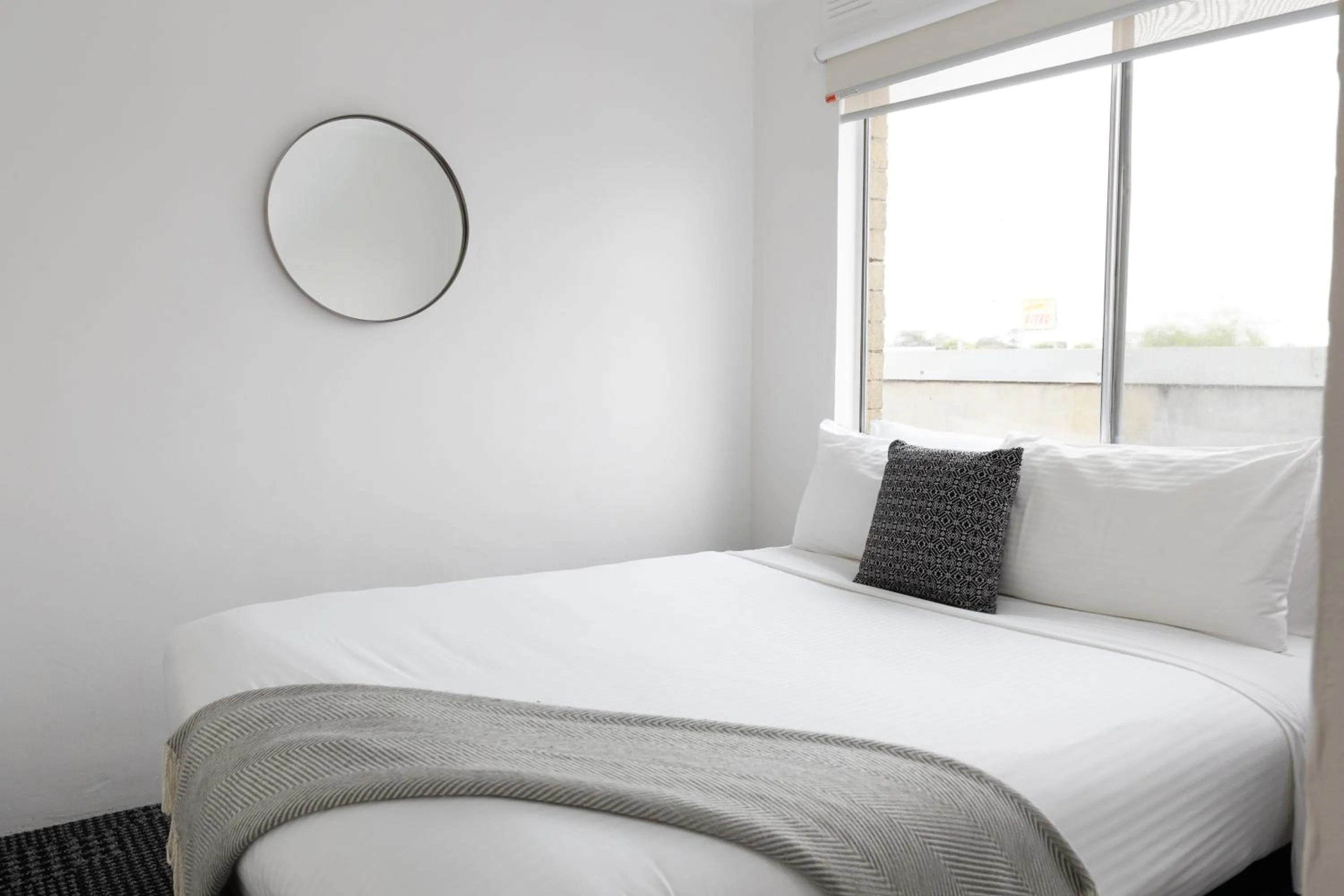 Bed in Siesta Central Apartments