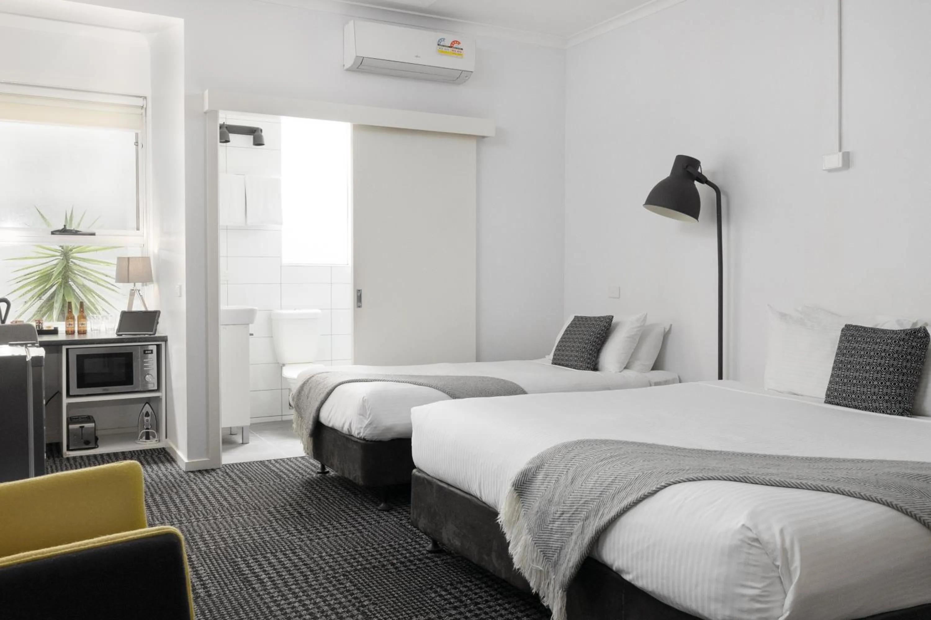 Bed in Siesta Central Apartments