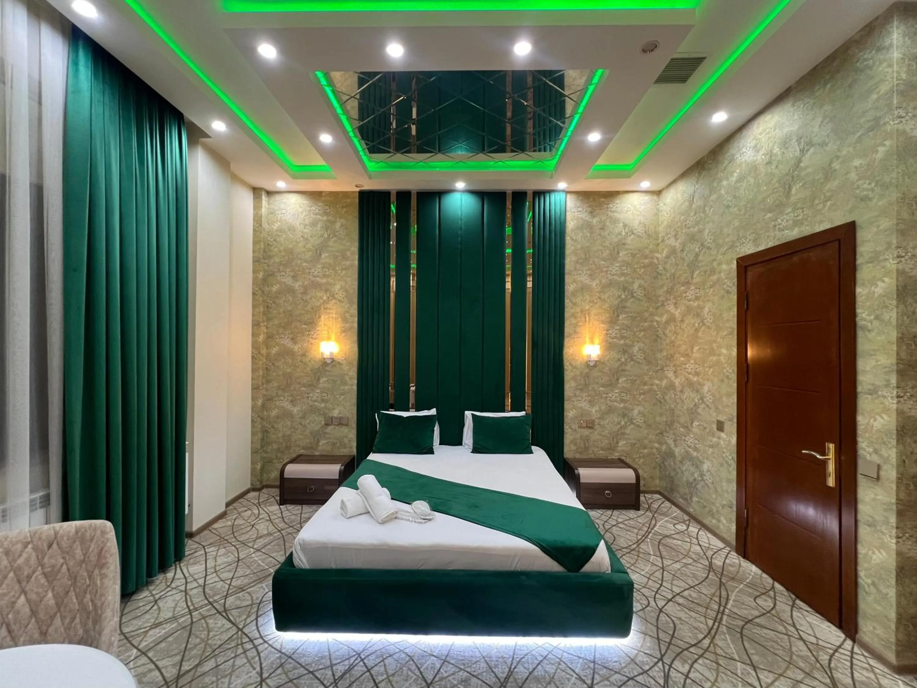 Bed in Royal Mansion Hotel