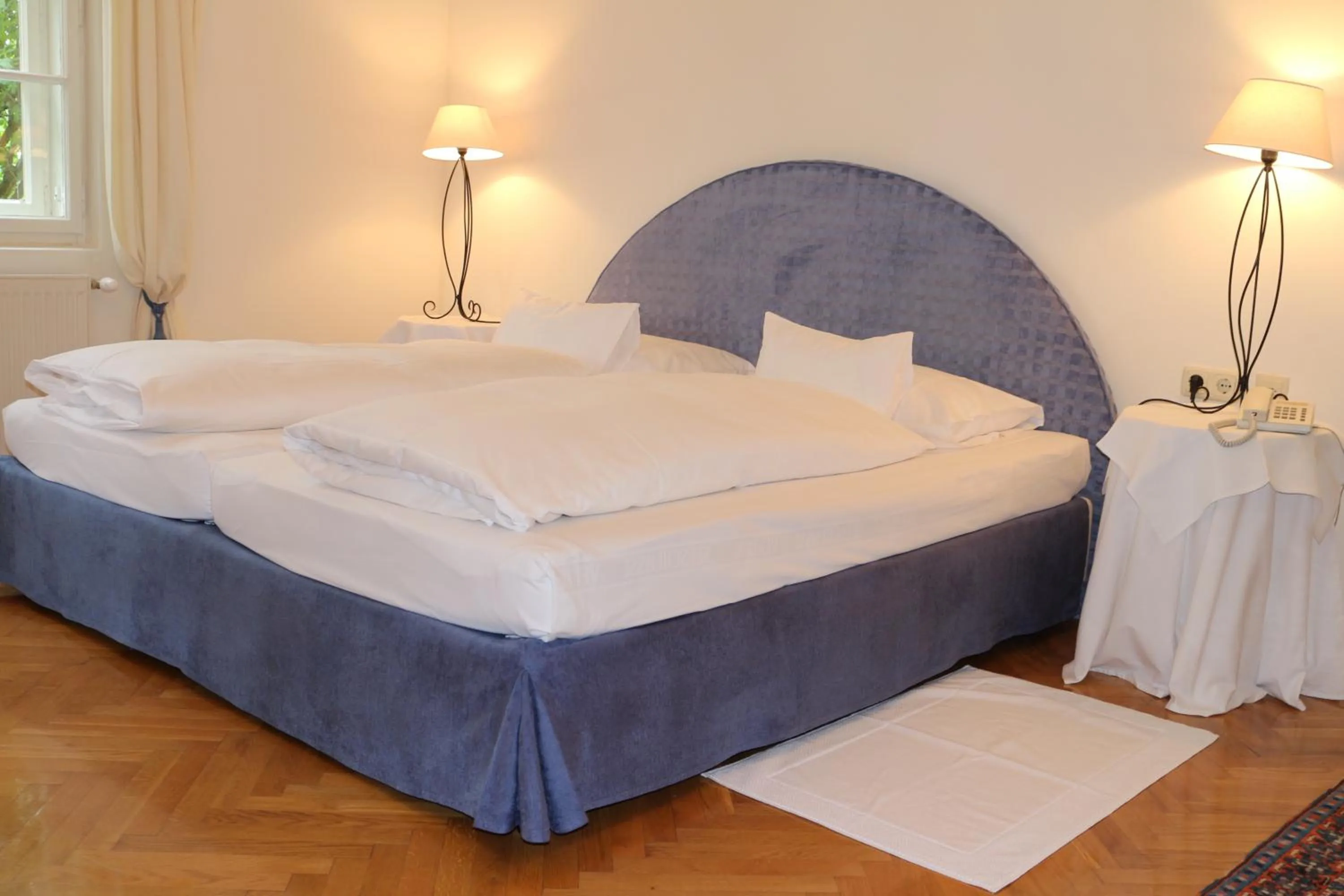 Photo of the whole room, Bed in Hotel Seeschlößl Velden