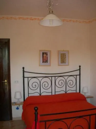 Bed in Elios Residence Hotel