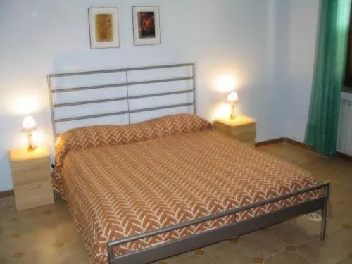 Bed in Elios Residence Hotel