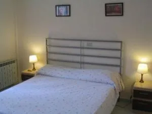 Bed in Elios Residence Hotel