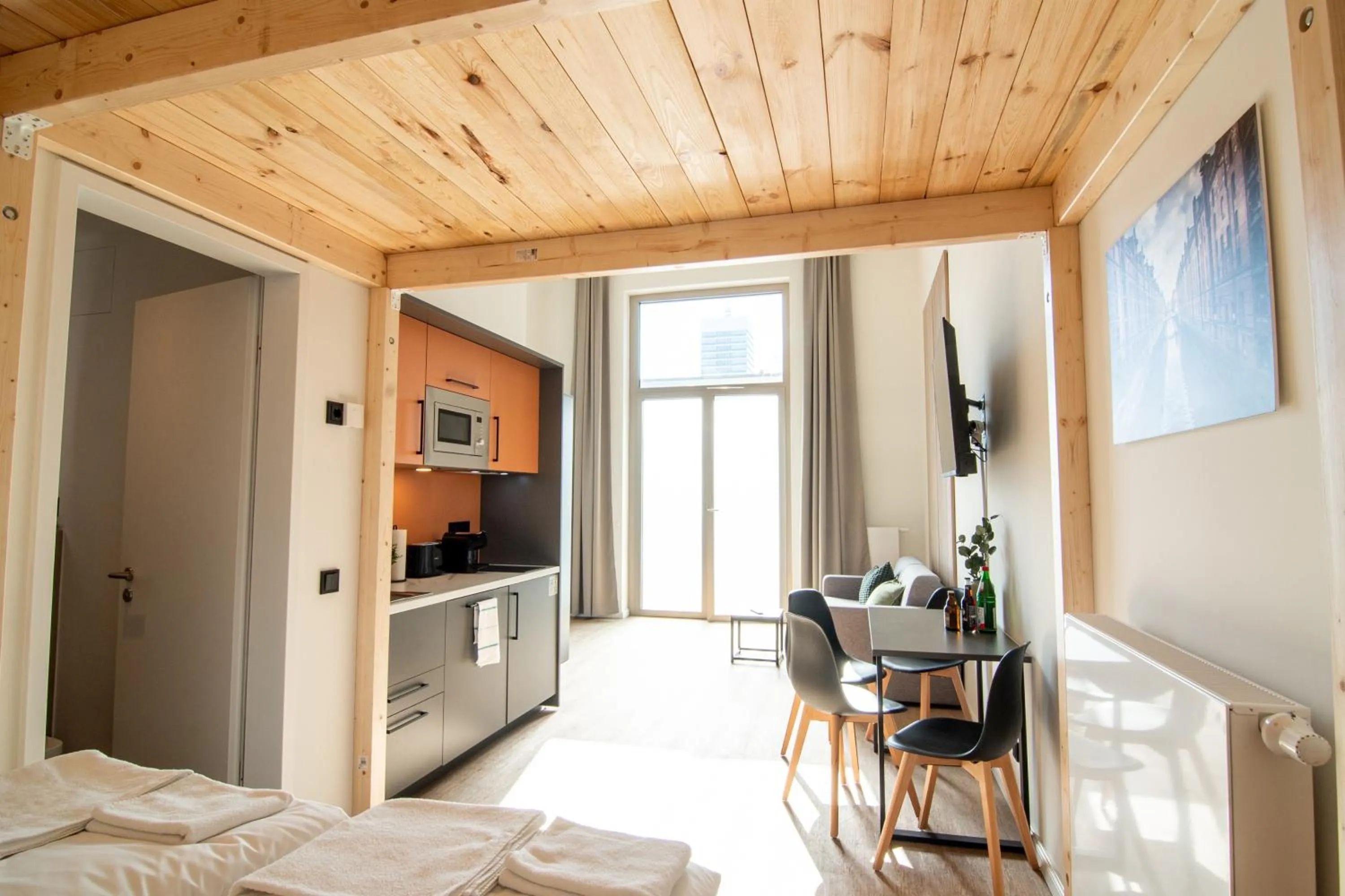 TV and multimedia, Bed in Homaris Apartments Winterhude