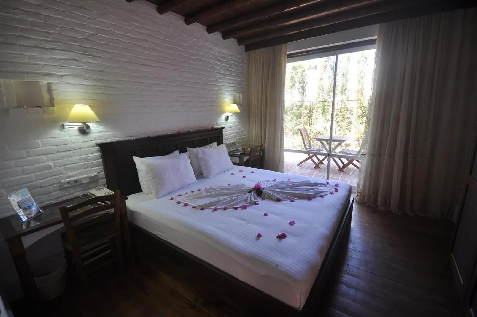 Bed in El Vino Hotel & Suites