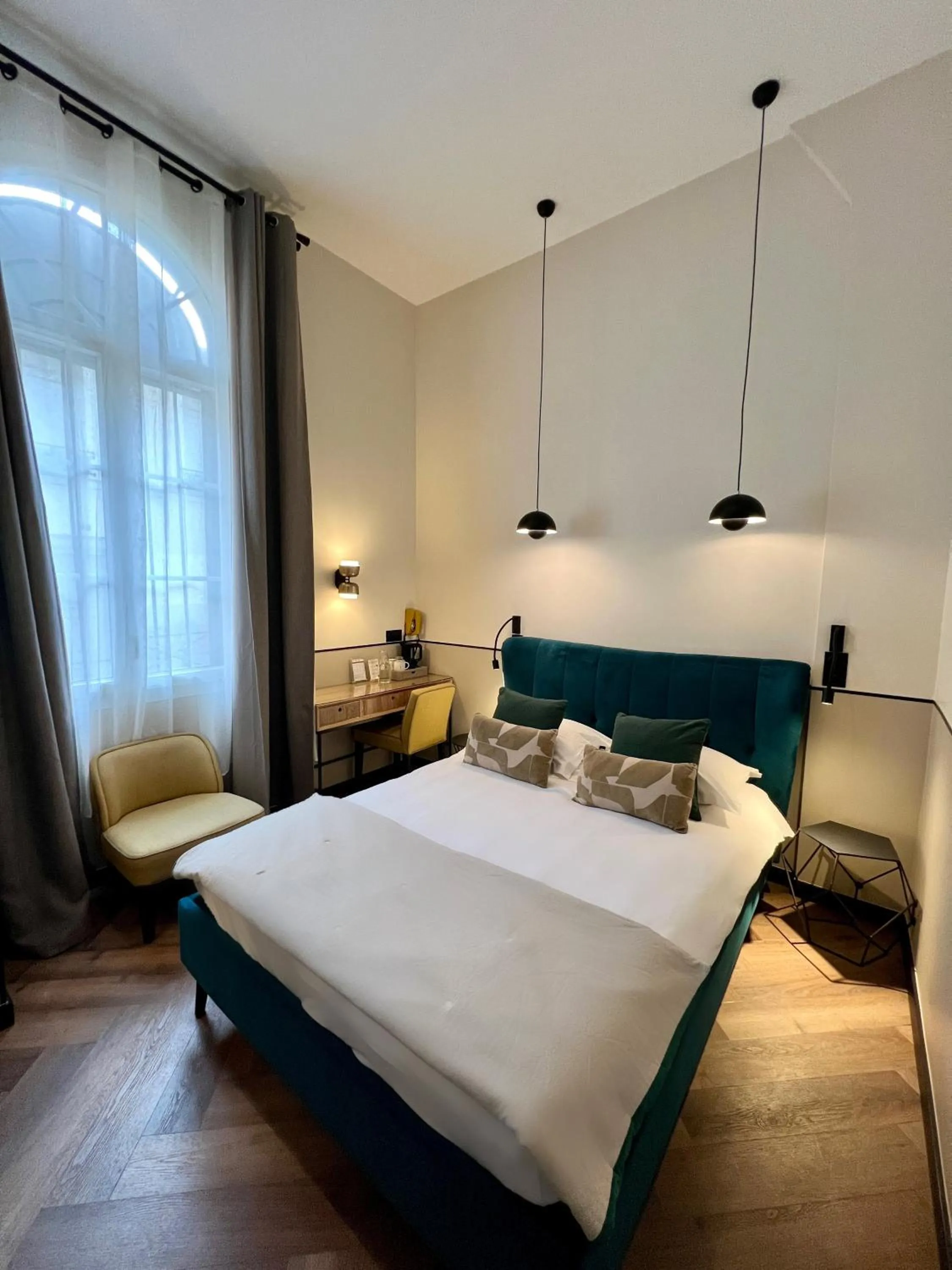 Bed in Hôtel des Beaux Arts