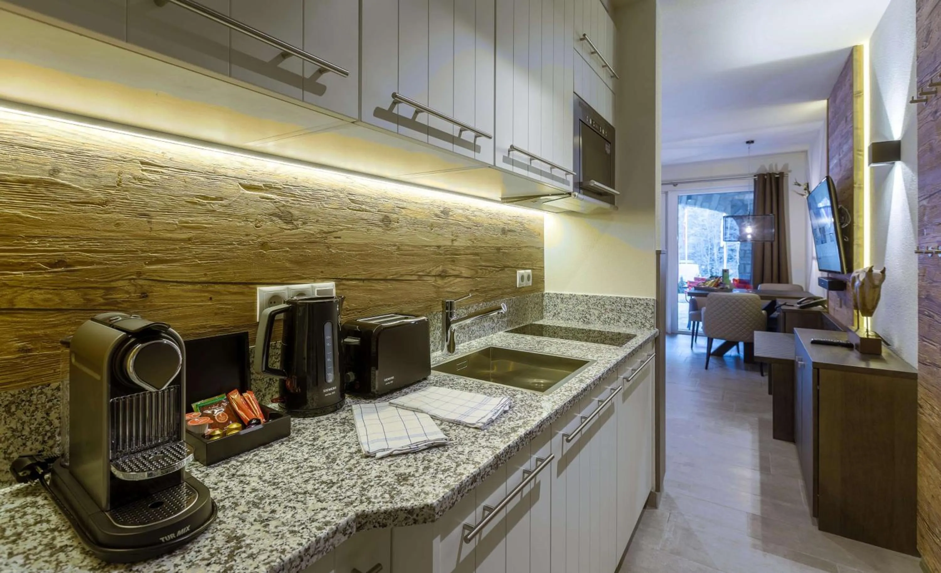 Kitchen or kitchenette in AvenidA Mountain Lodges Saalbach