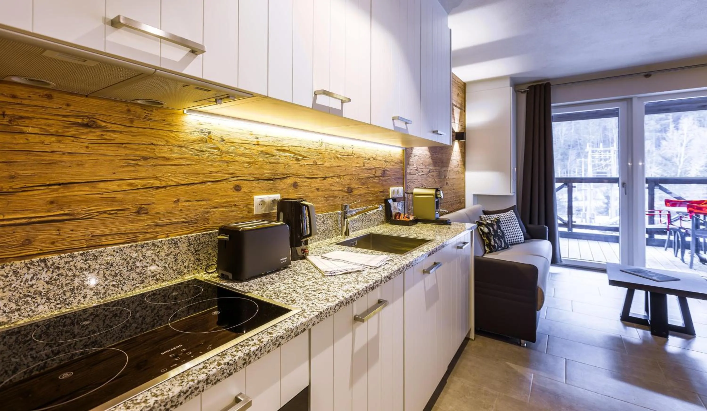 Kitchen or kitchenette in AvenidA Mountain Lodges Saalbach