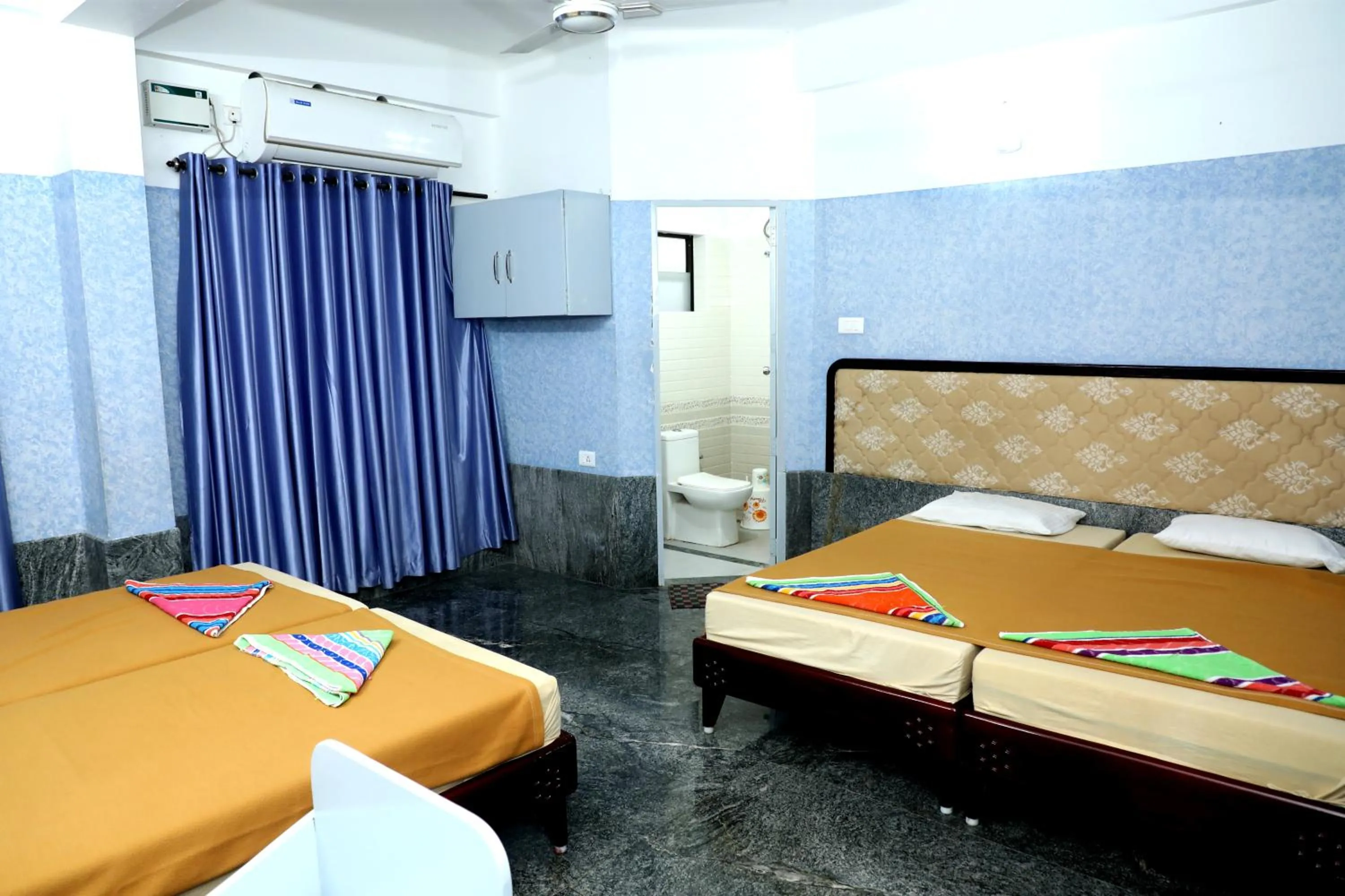 Bed in Sauhrudam Resort and Restaurant-Kanyakumari