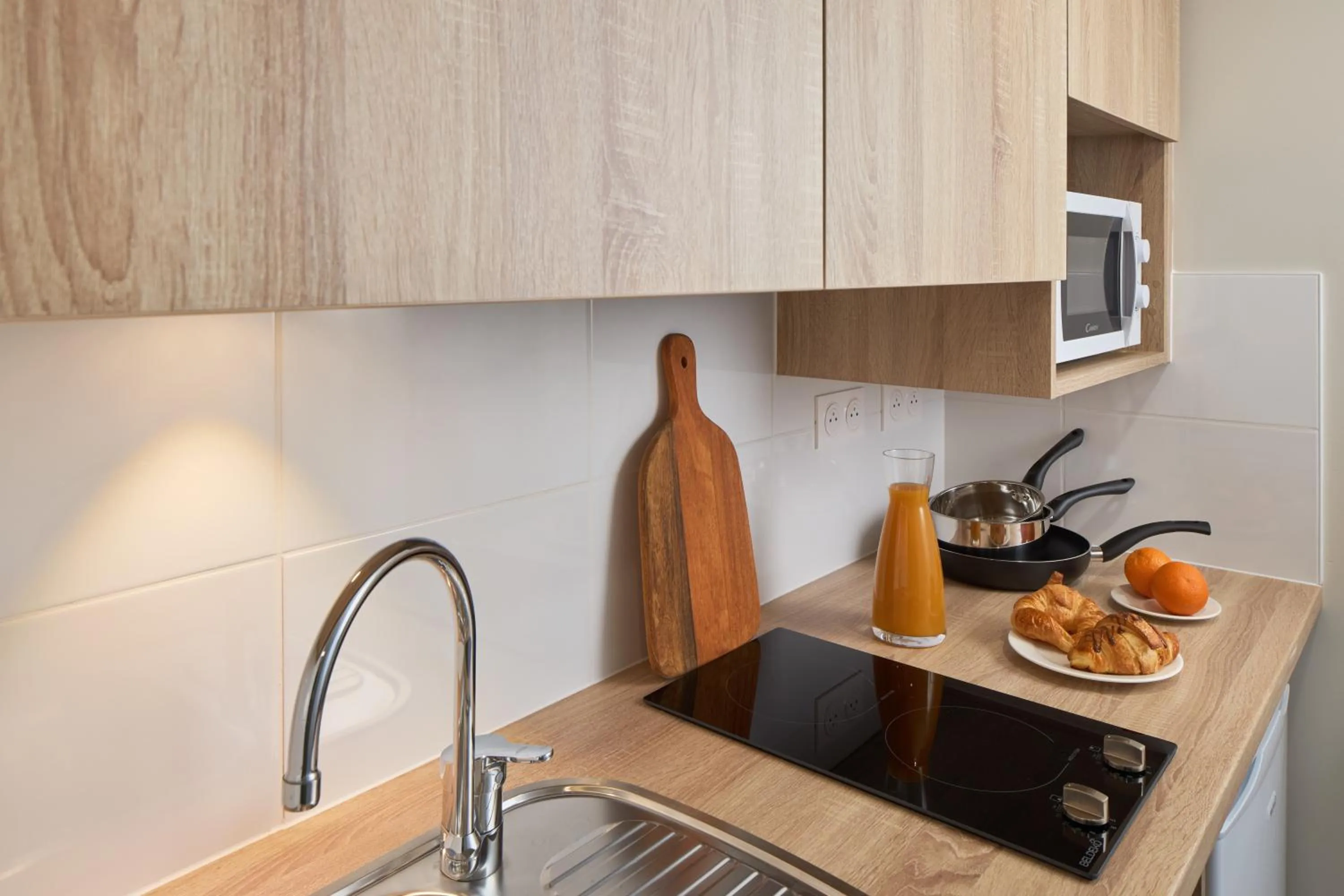 Kitchen or kitchenette in Zenitude Quality Aparthotel Nancy Centre