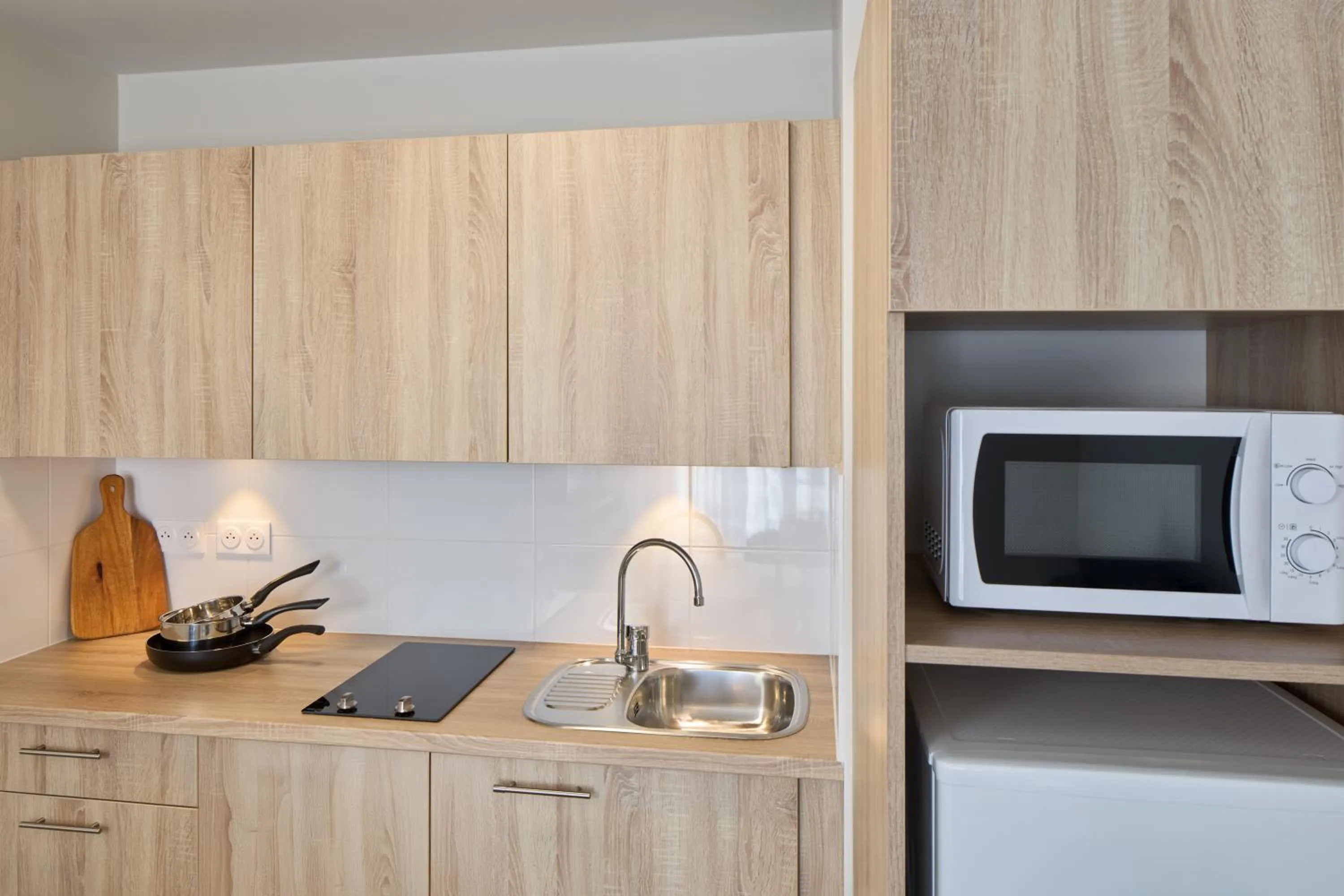 Kitchen or kitchenette in Zenitude Quality Aparthotel Nancy Centre