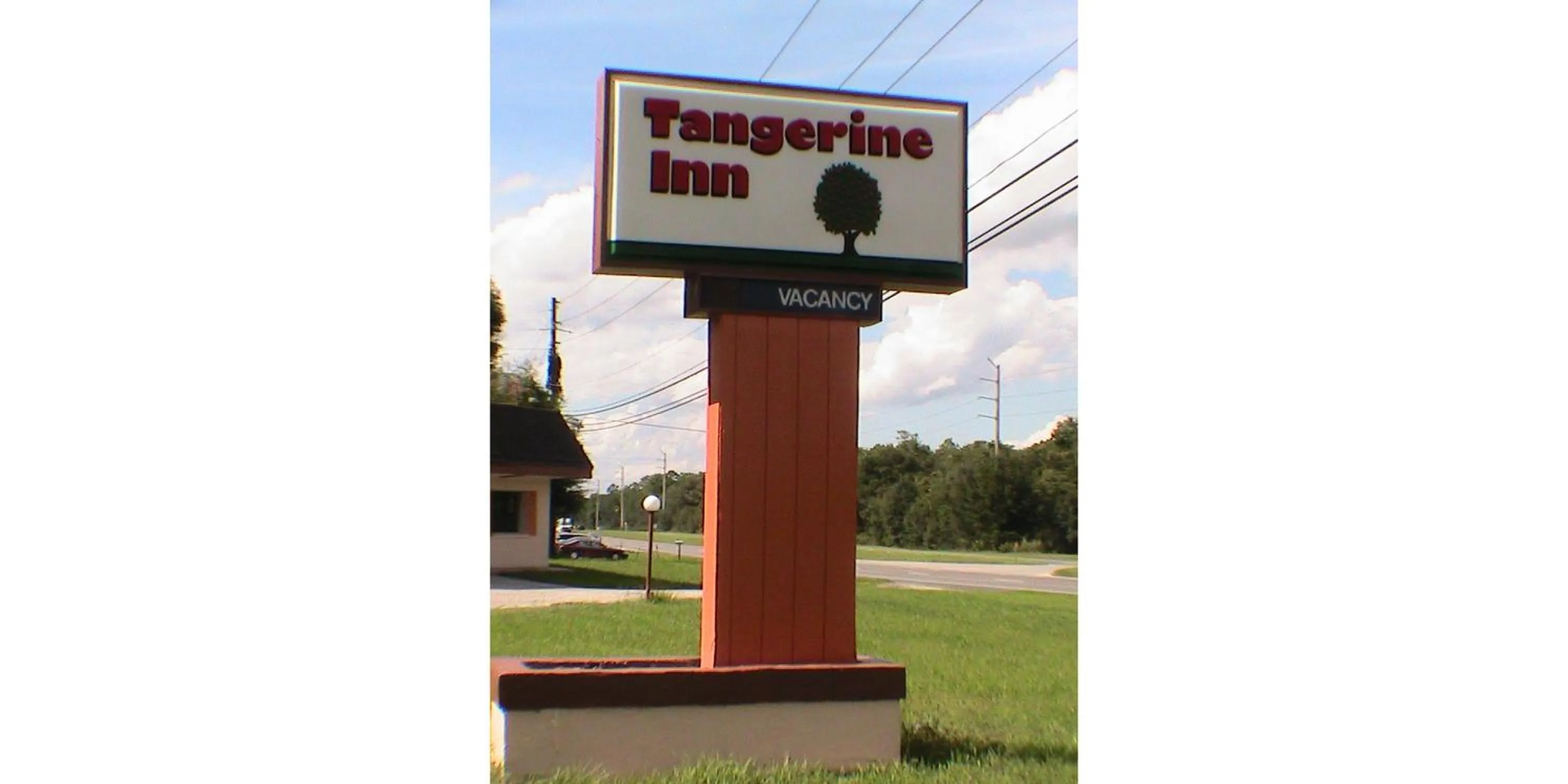 Property logo or sign in At Home Express Tangerine Inn