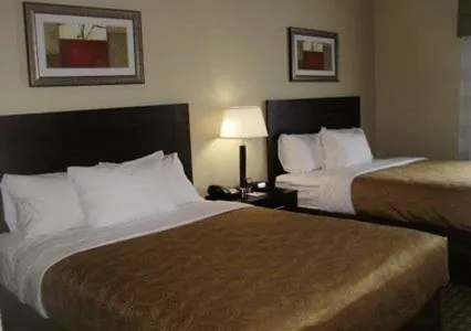 Bed in MainStay Suites Meridian - Bonita Lakes