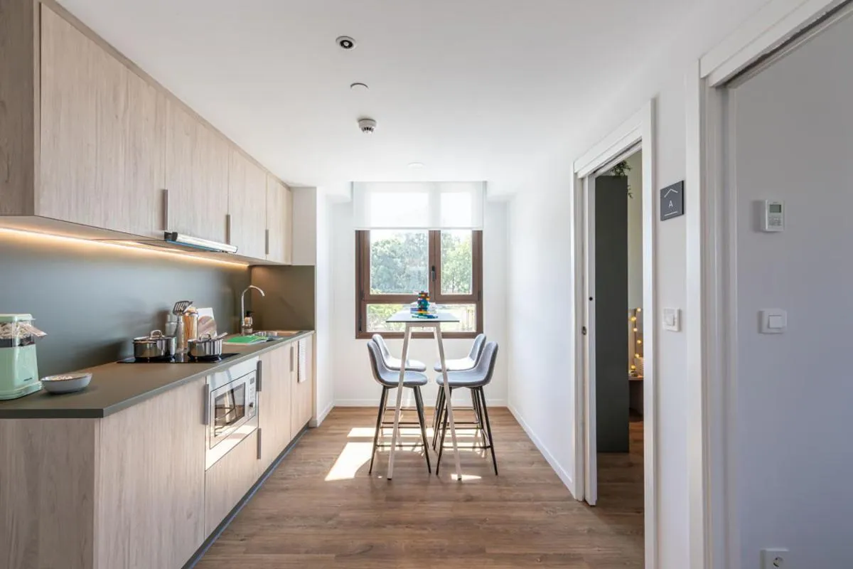 Kitchen or kitchenette in NIDO Malvarrosa Hotel - Apartamento