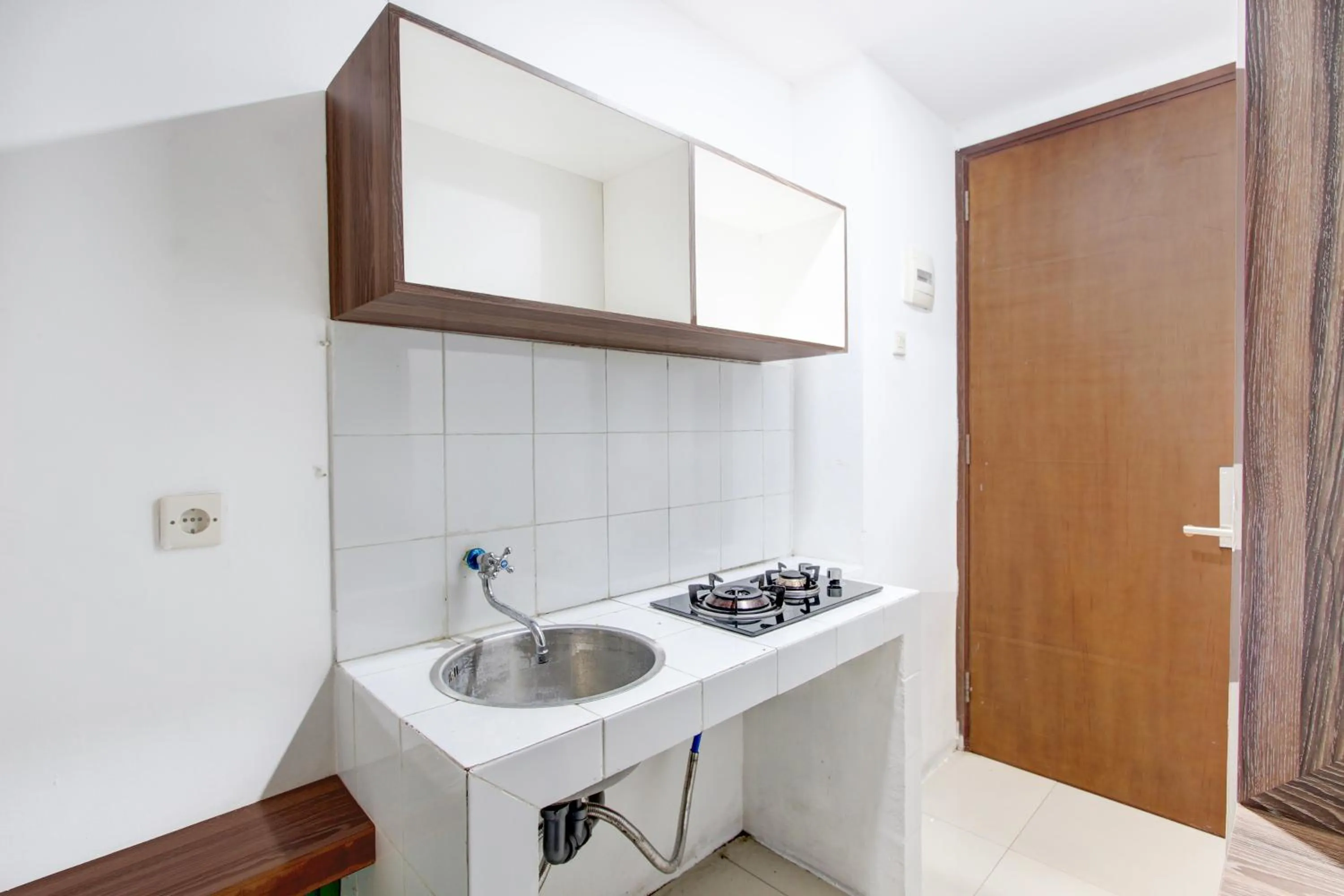 Kitchen or kitchenette in Collection O Yogyakarta Near Tugu Jogja Formerly Vivo Aparment