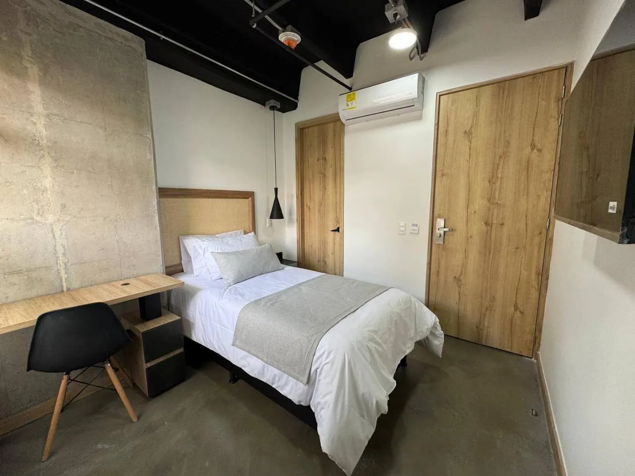 Bed in Akela Park Hotel