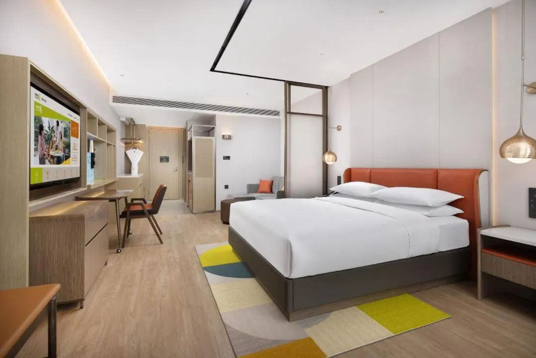 Bed in Home2 Suite by Hilton Shenyang Yuhong