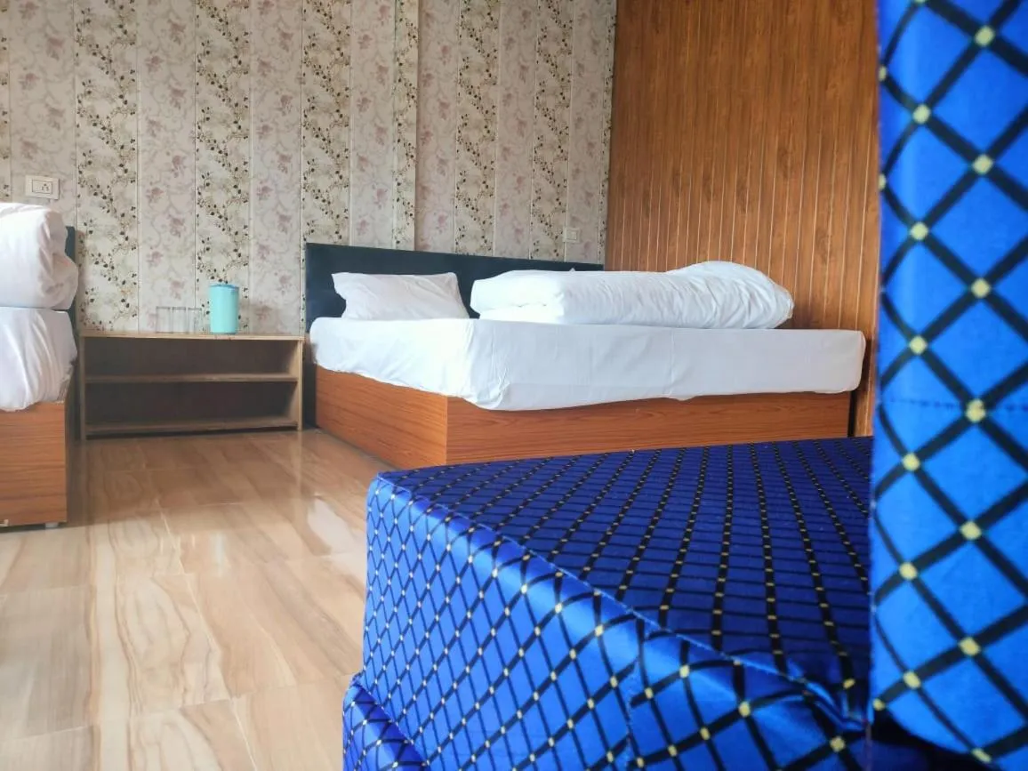 Bed in Chaukhamba view Resort