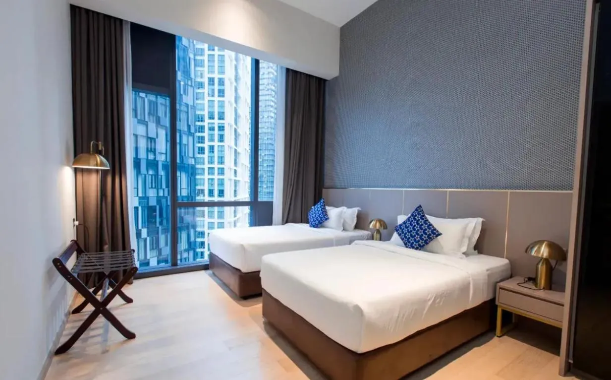 Bed in Star Deluxe Suites KLCC by WSD