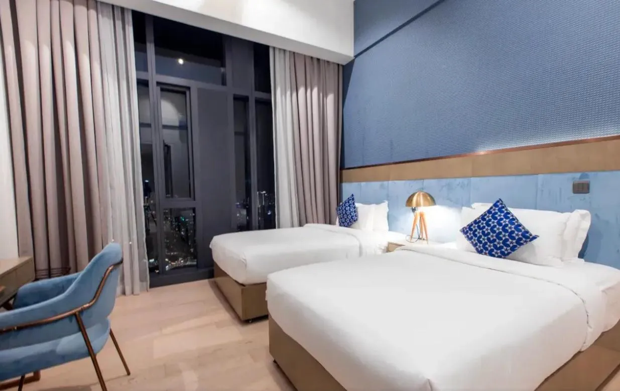 Bed in Star Deluxe Suites KLCC by WSD