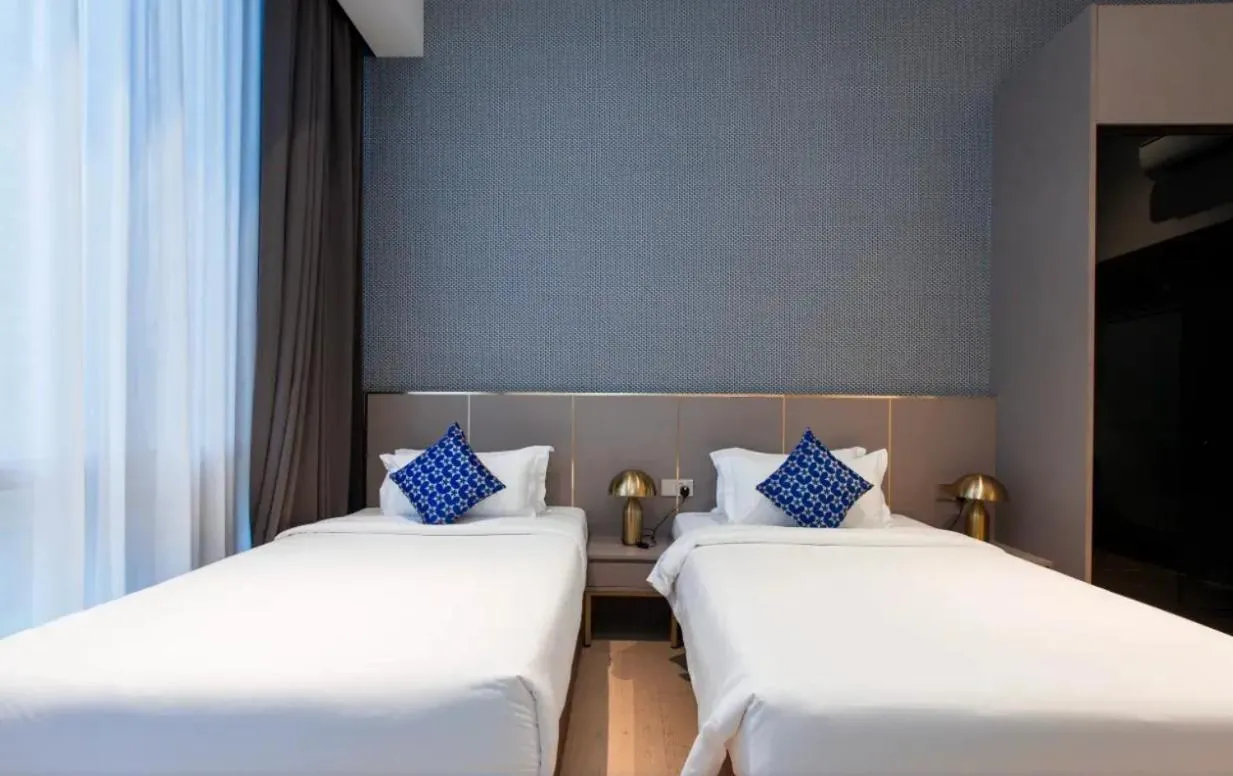 Bed in Star Deluxe Suites KLCC by WSD