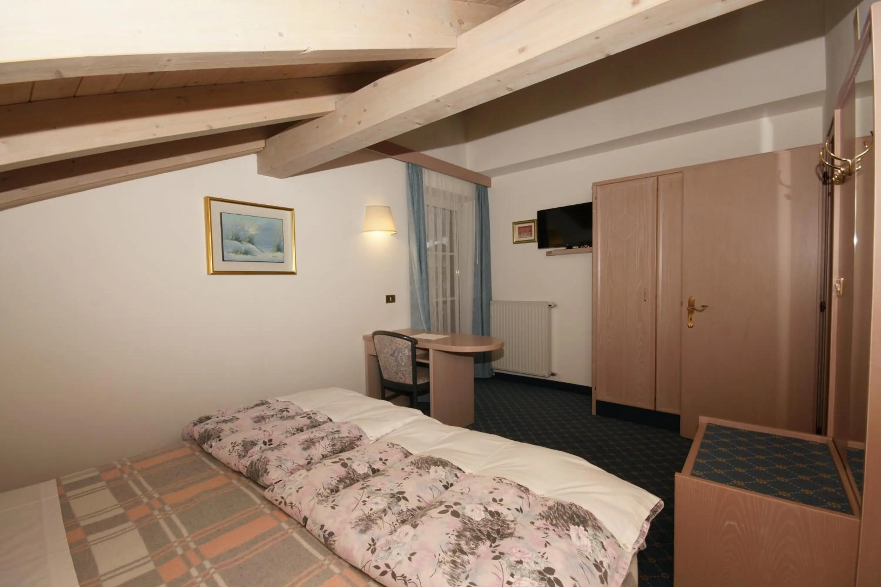 Bed in Hotel Villa Mozart