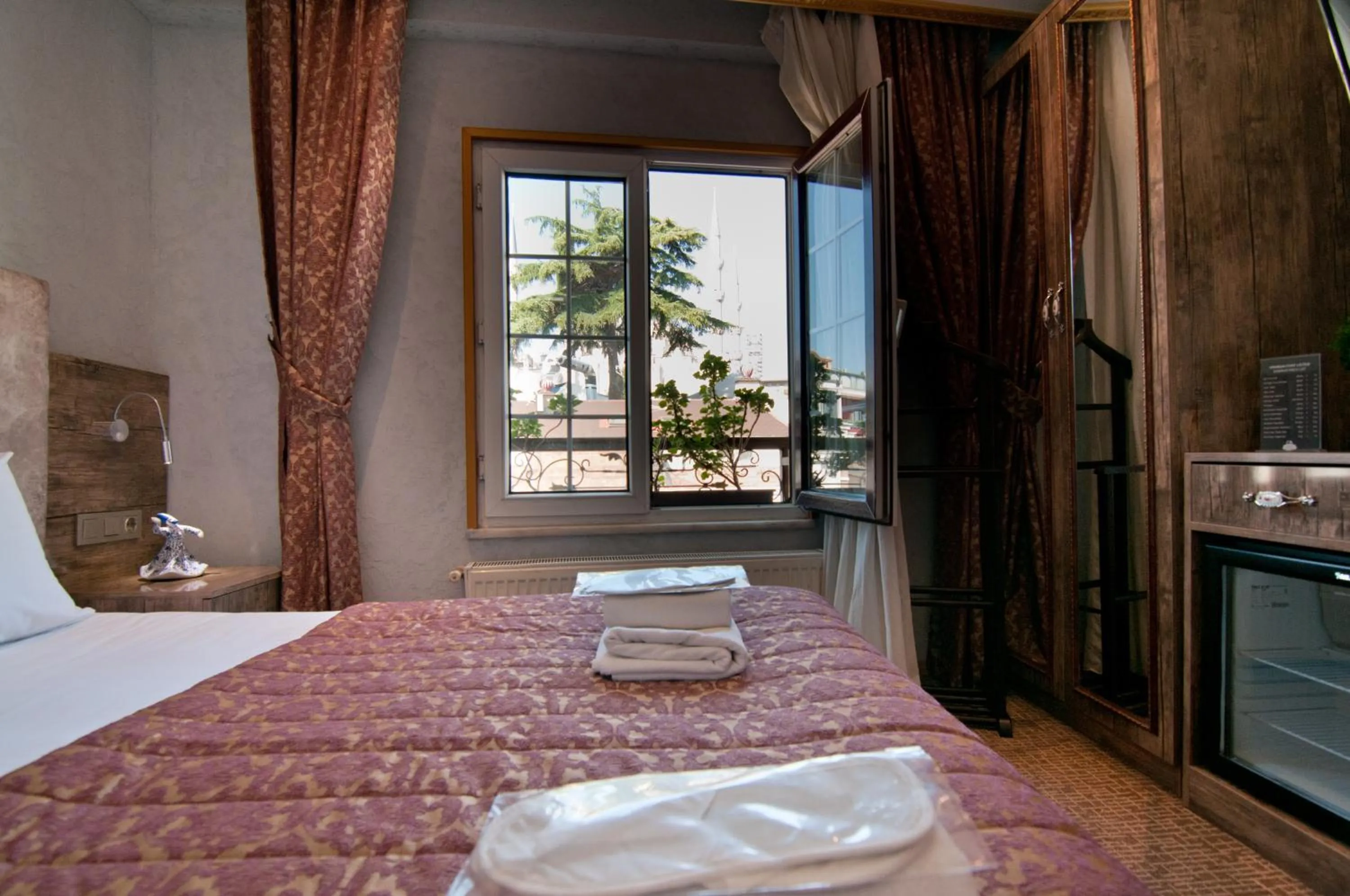 Bedroom, Bed in Grand Ambiance Hotel