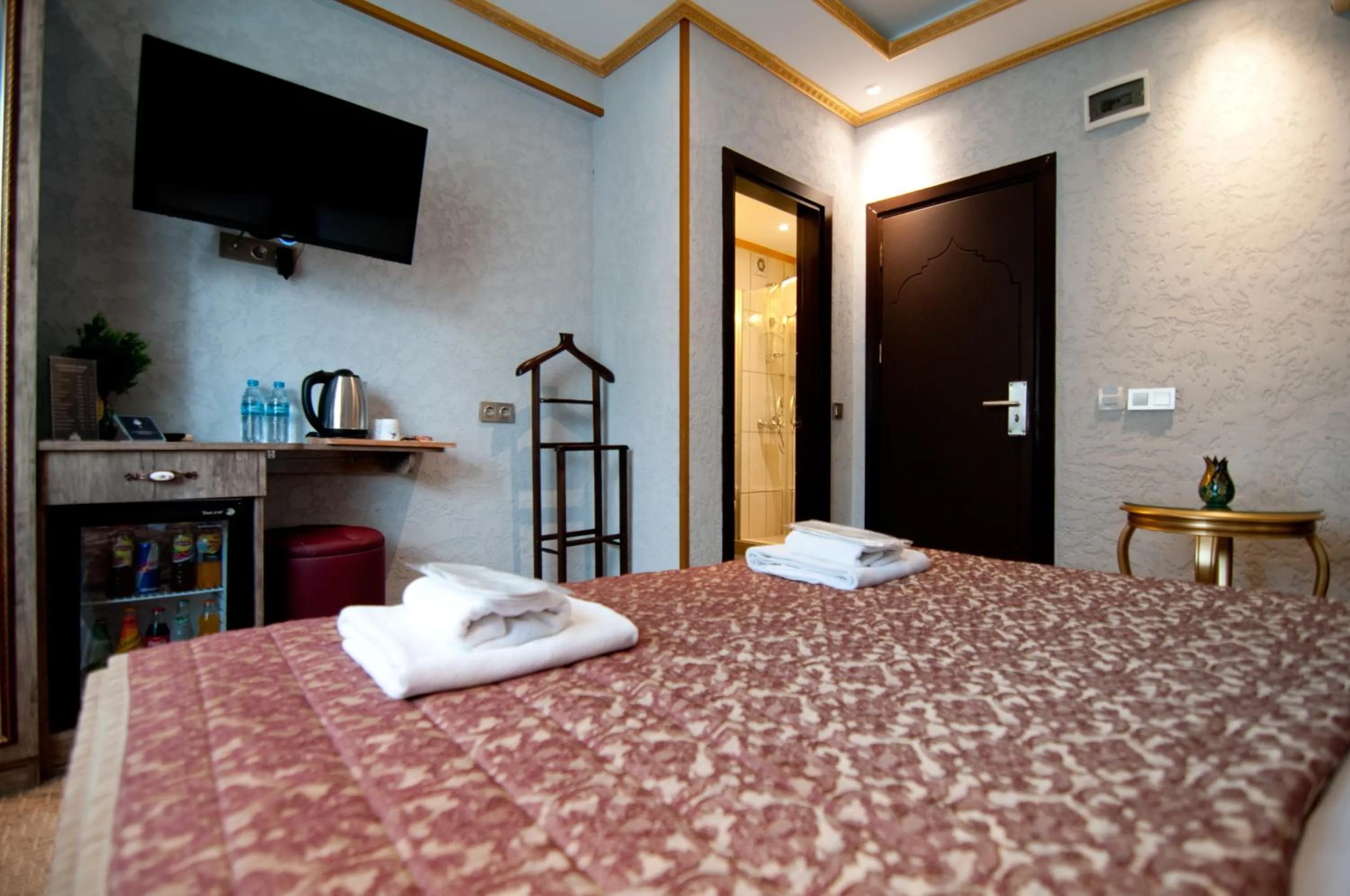 Bed in Grand Ambiance Hotel