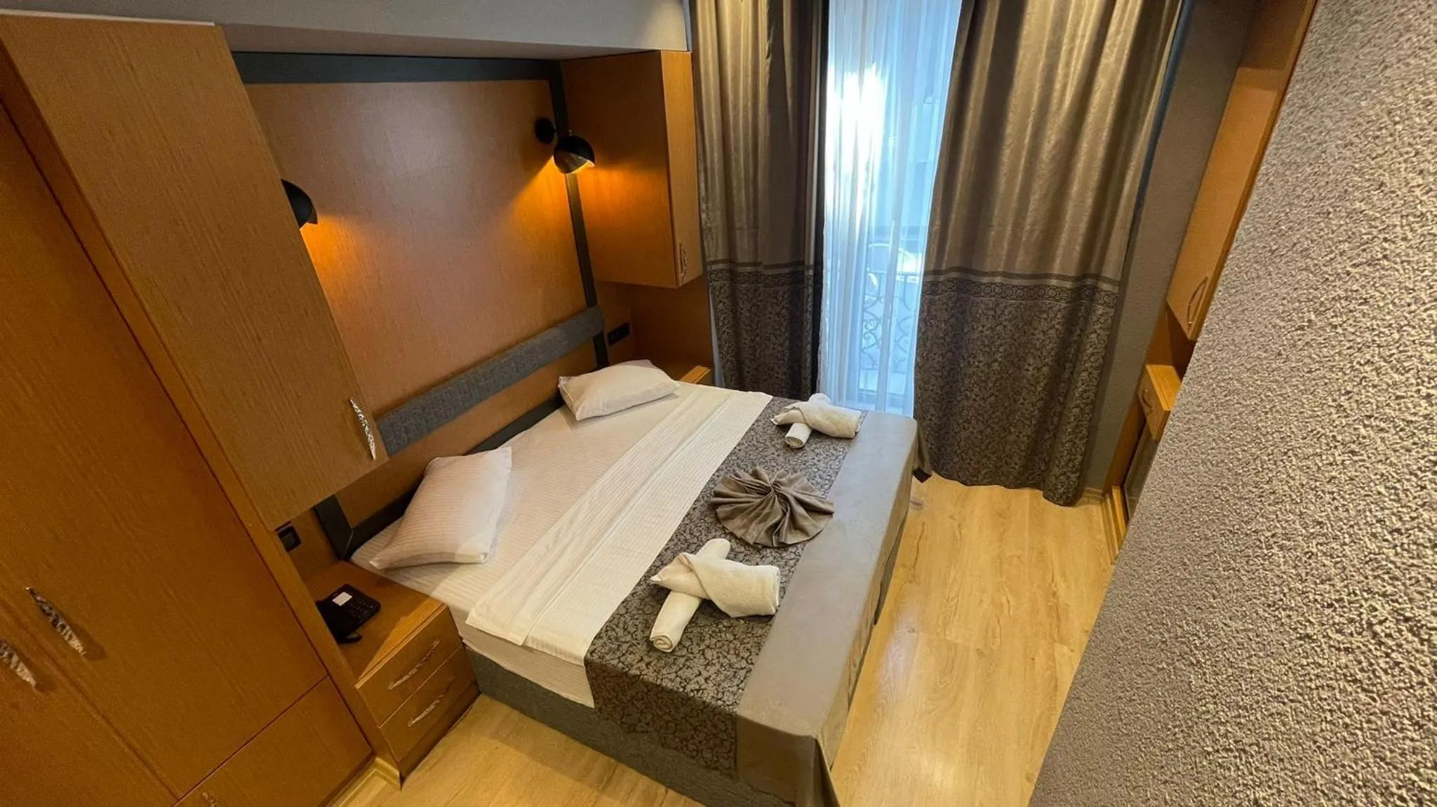 Photo of the whole room, Bed in Grand Ambiance Hotel