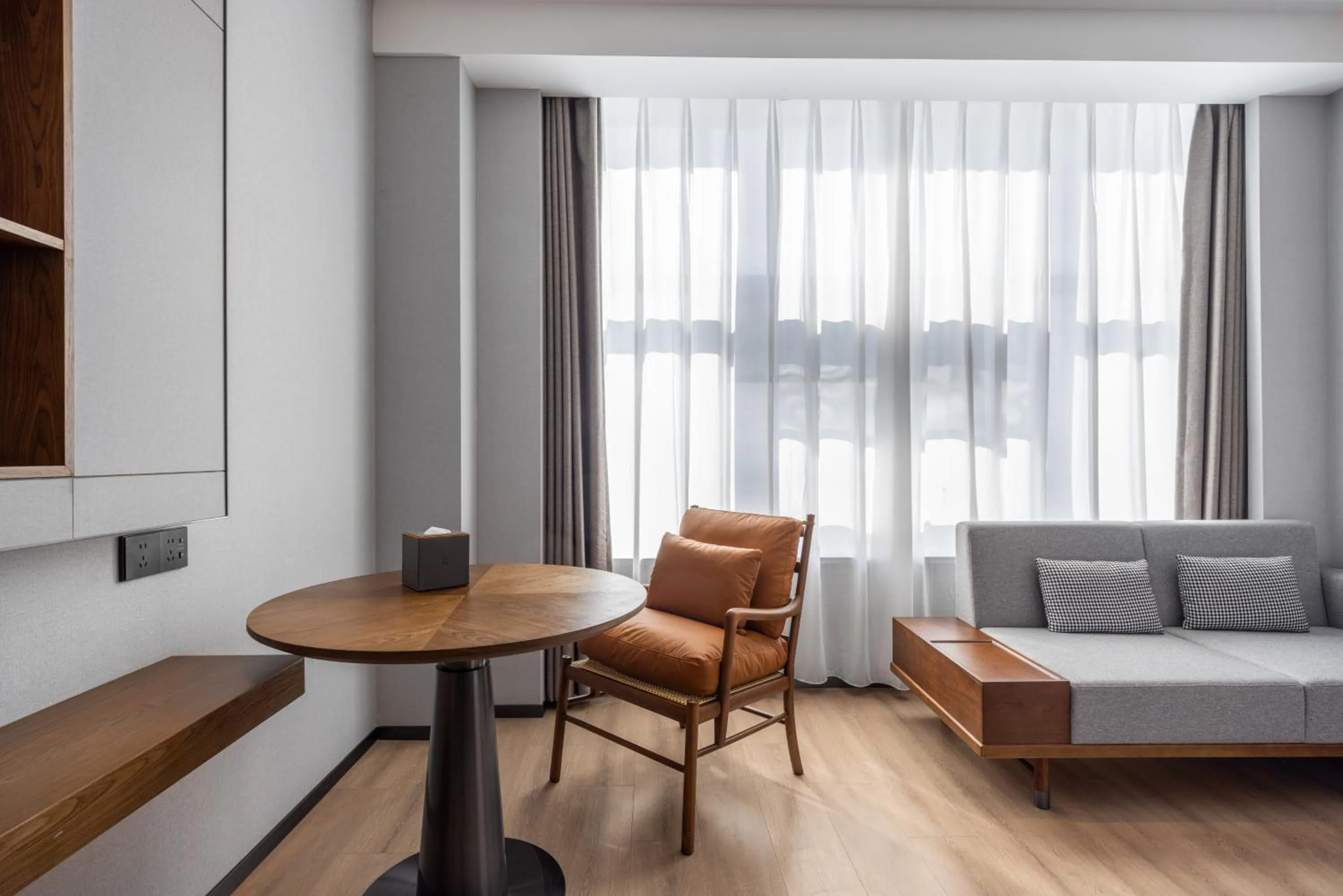 Seating area in UrCove By Hyatt Guangzhou Baiyun Airport