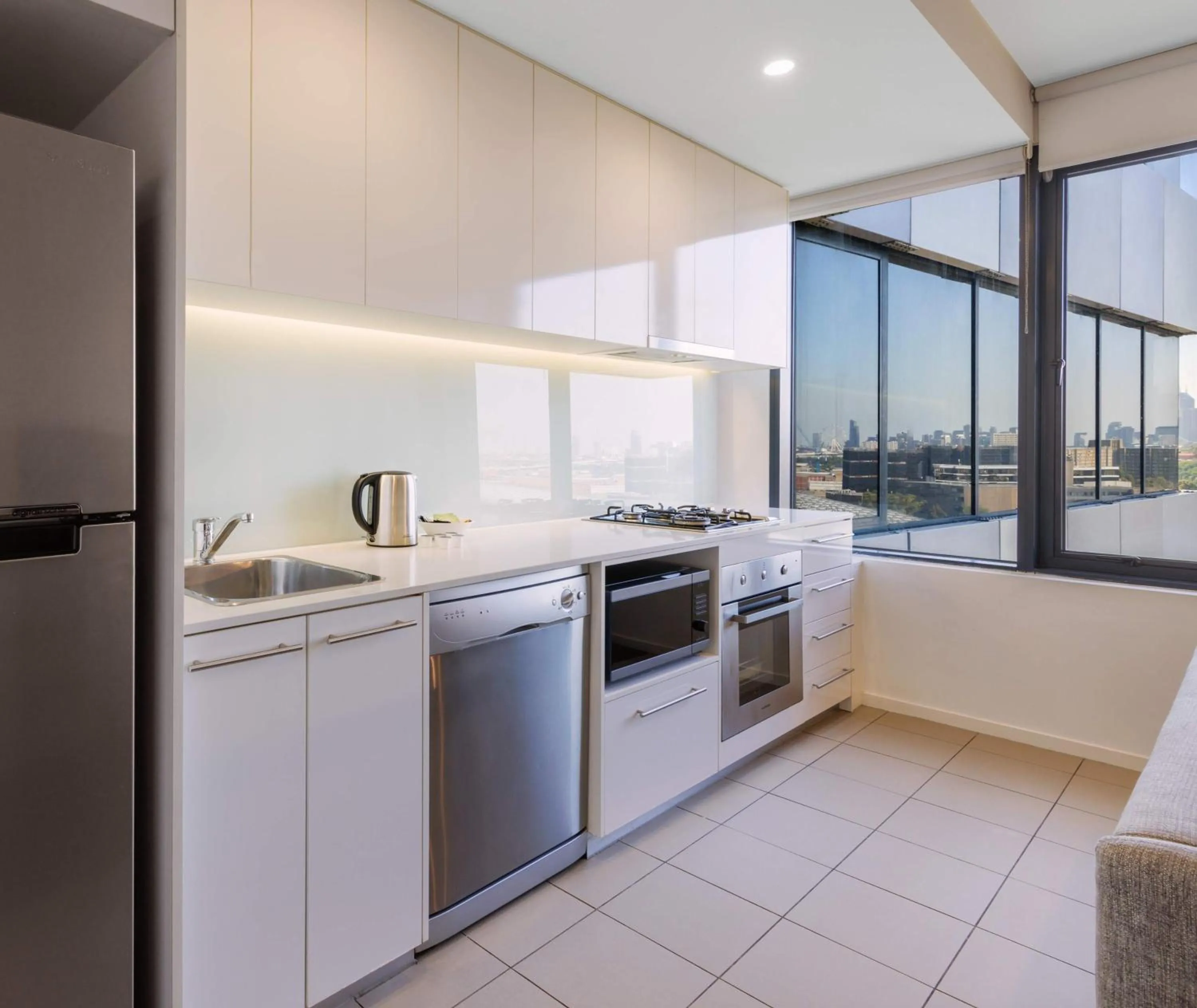 Kitchen or kitchenette in Oaks Melbourne Flemington Suites