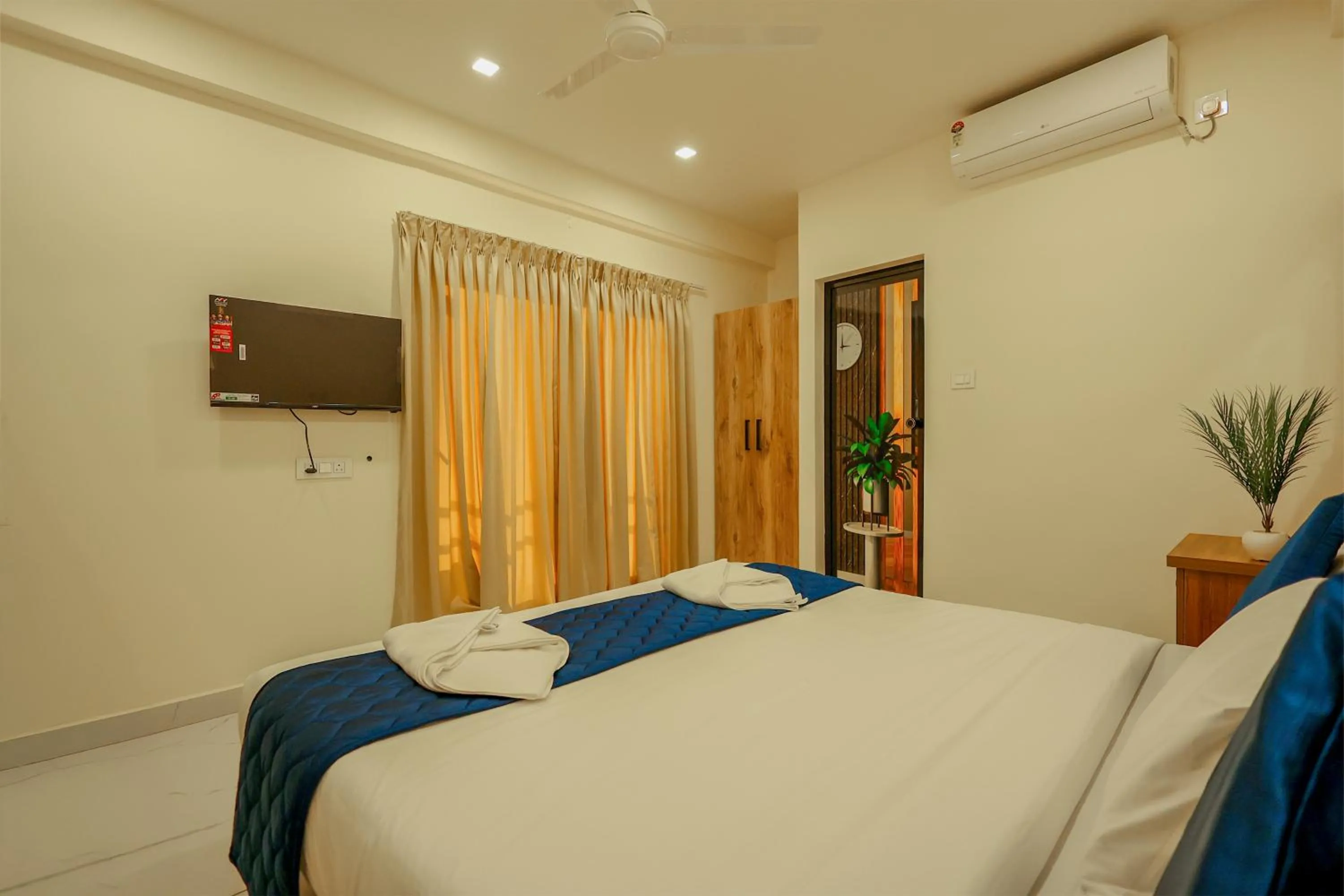 Triple Room with Balcony in Moonic Days Infopark Kakkanad