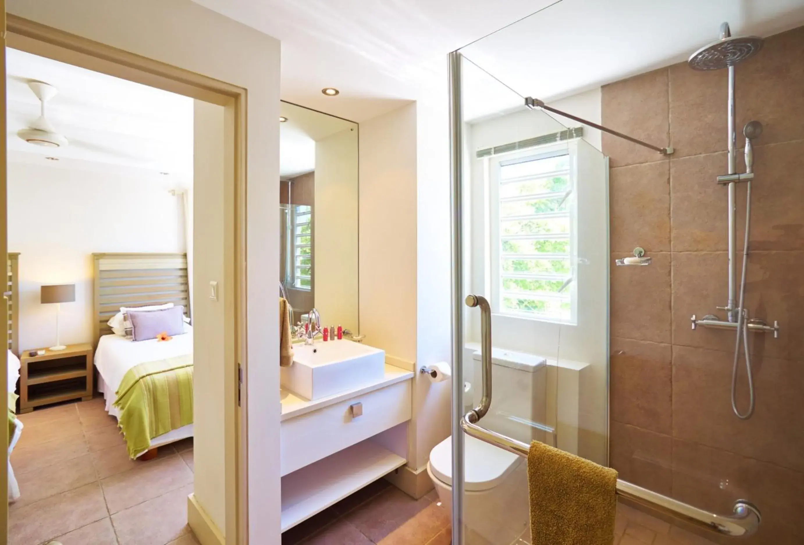 Shower, Bed in Cape Point Seafront by LOV Mauritius Shower, Bed in Cape Point Seafront by LOV Mauritius