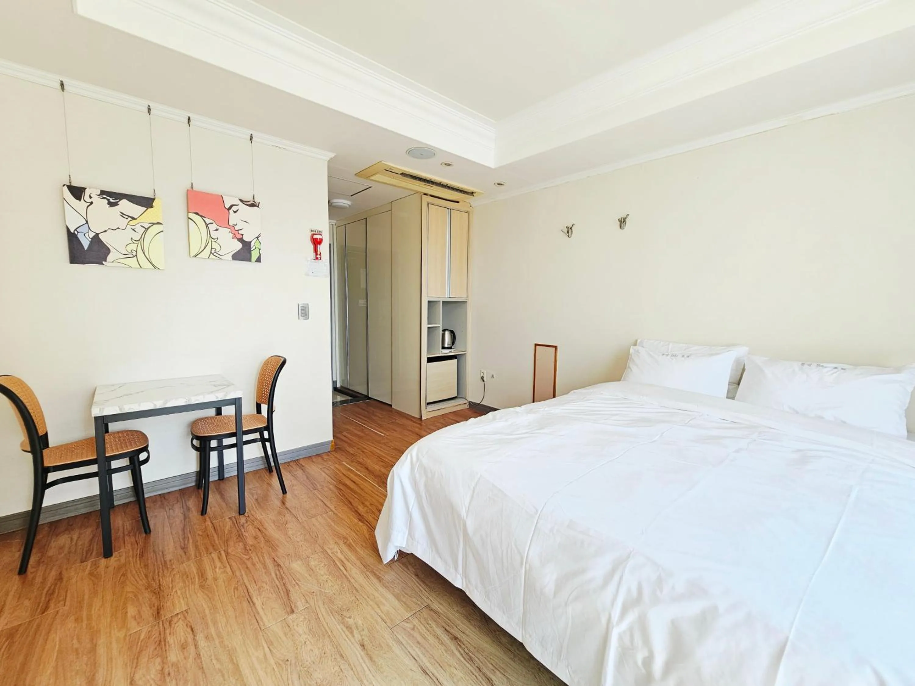 Bed in Tongyeong Bay Condo Hotel