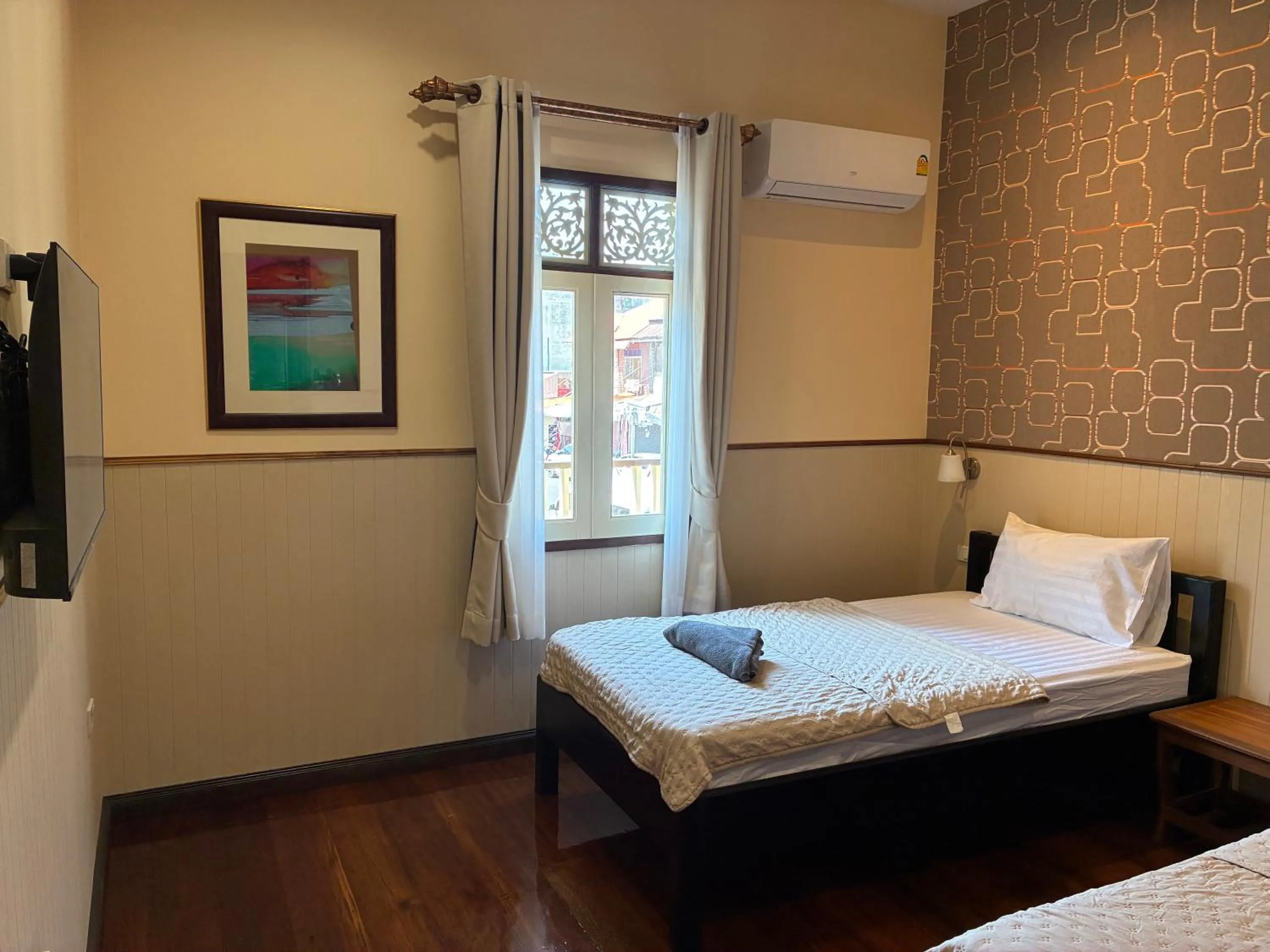 Bed in Noom Guesthouse