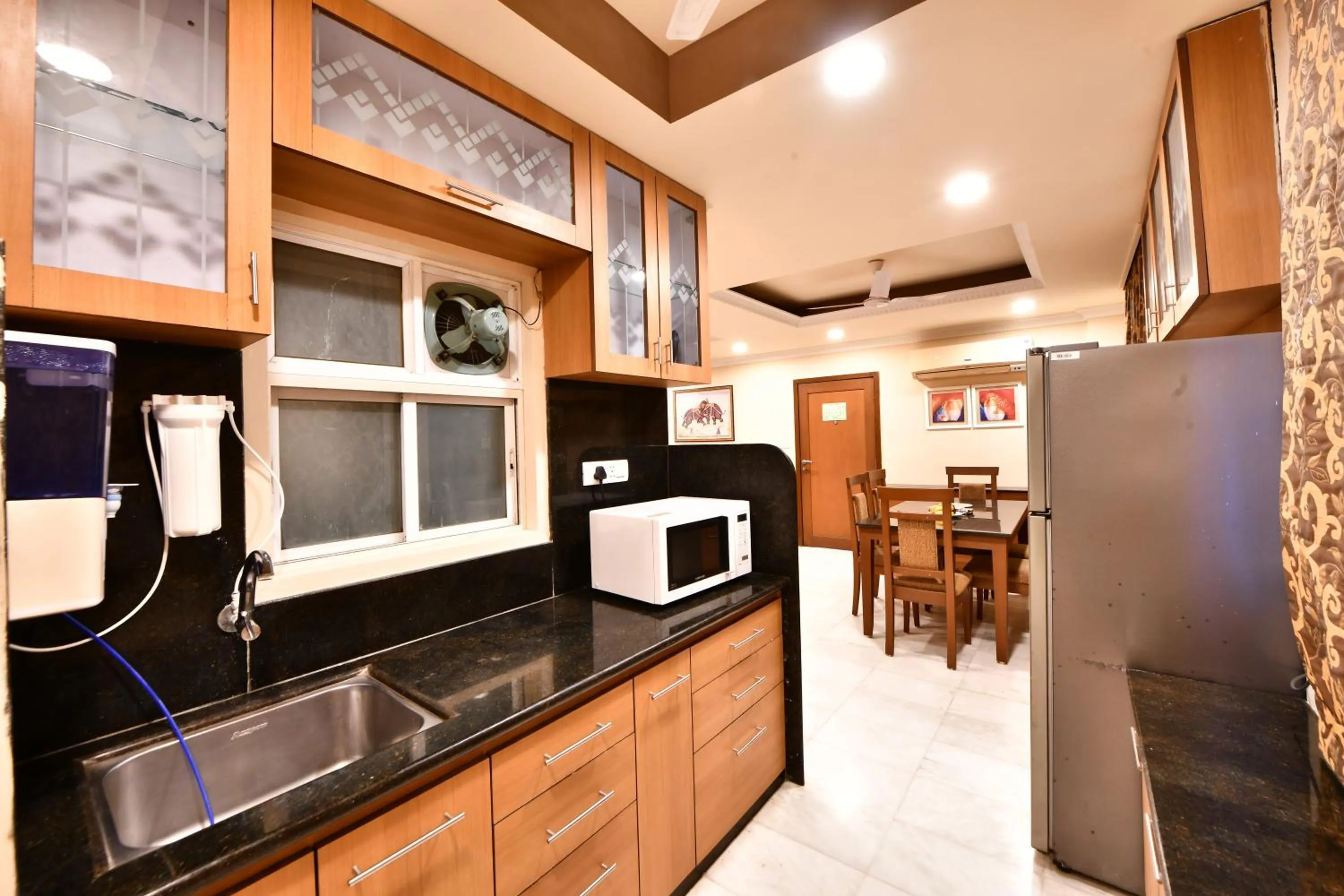 Kitchen or kitchenette in Click White House Residency, Vadodara