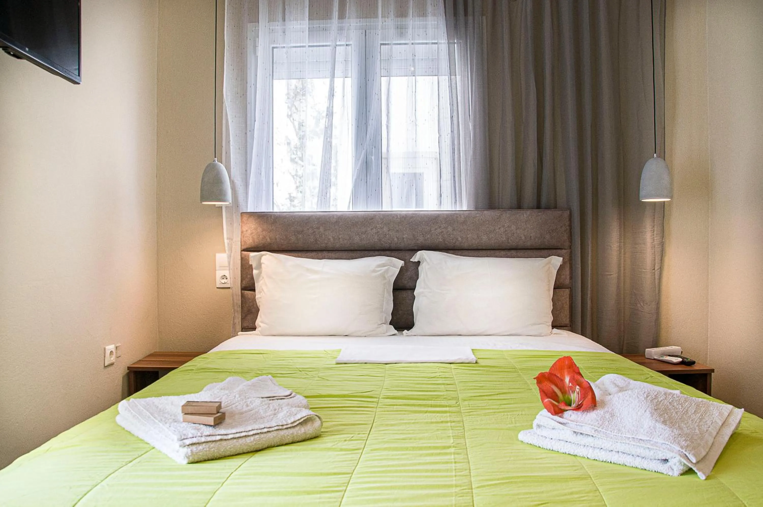 Photo of the whole room, Bed in Christina Rooms