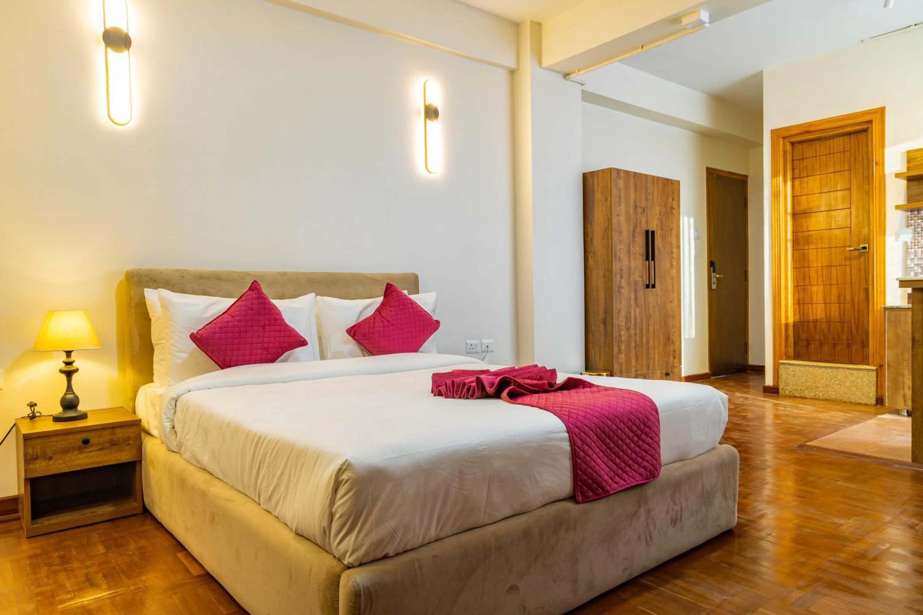 Bed in Mhendo Hotel & Studio Suites